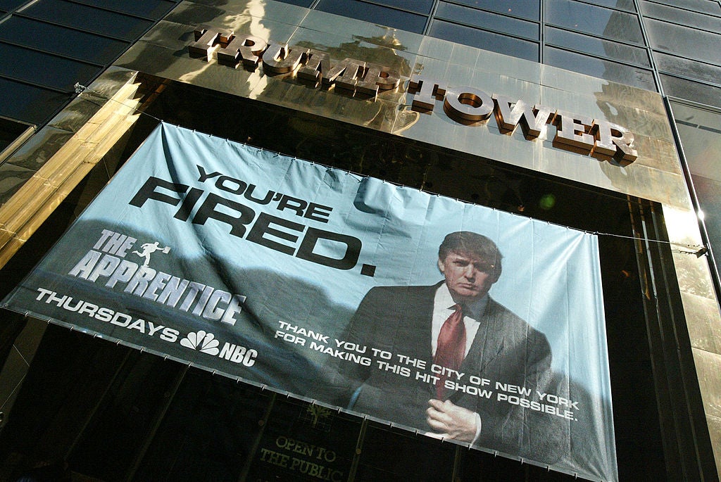 A promotional banner for The Apprentice adorns Trump Tower
