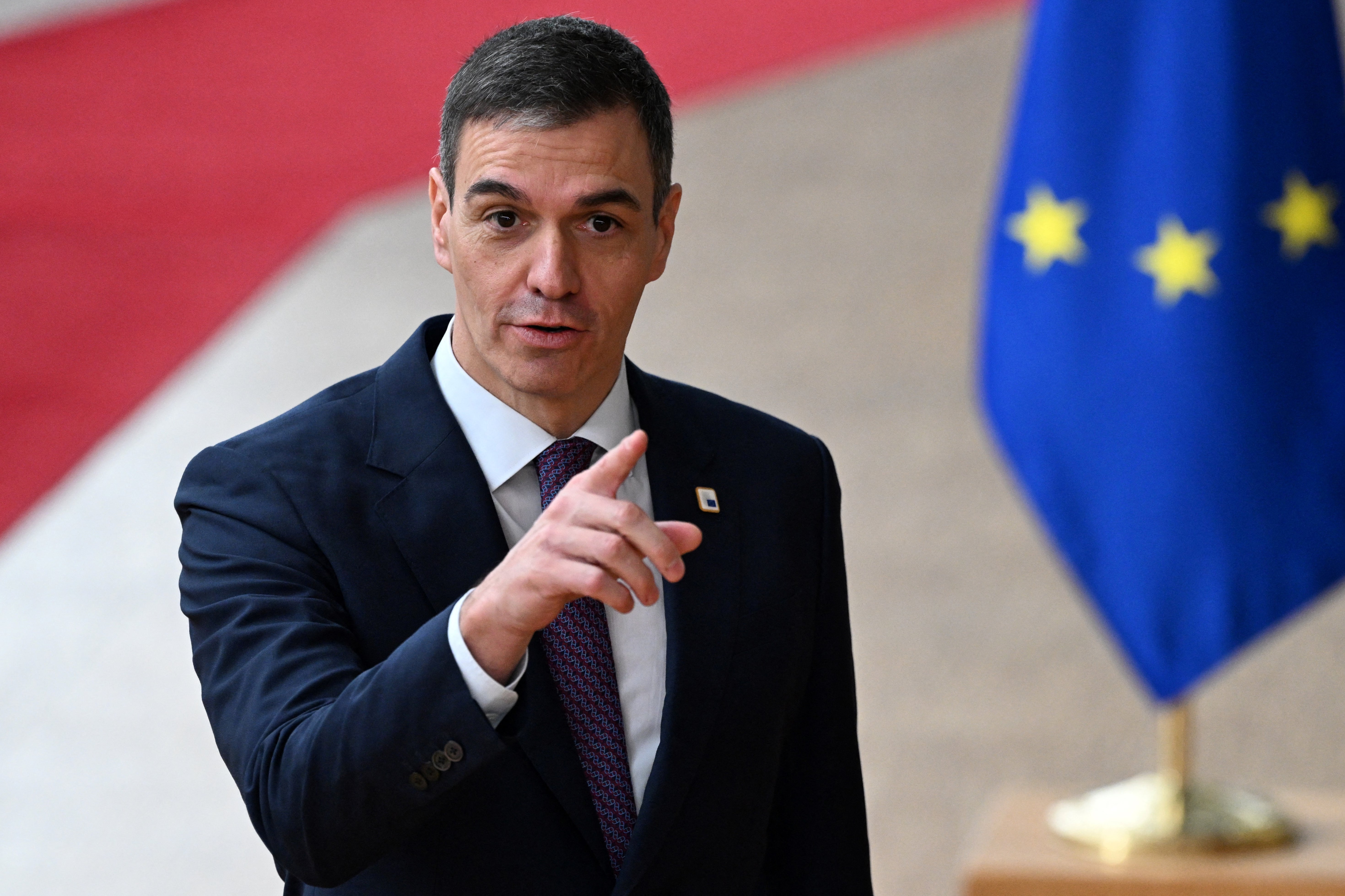 Spain’s prime minister Pedro Sanchez speaks to the press as he arrives to attend a European Council summit at the EU headquarters in Brussels