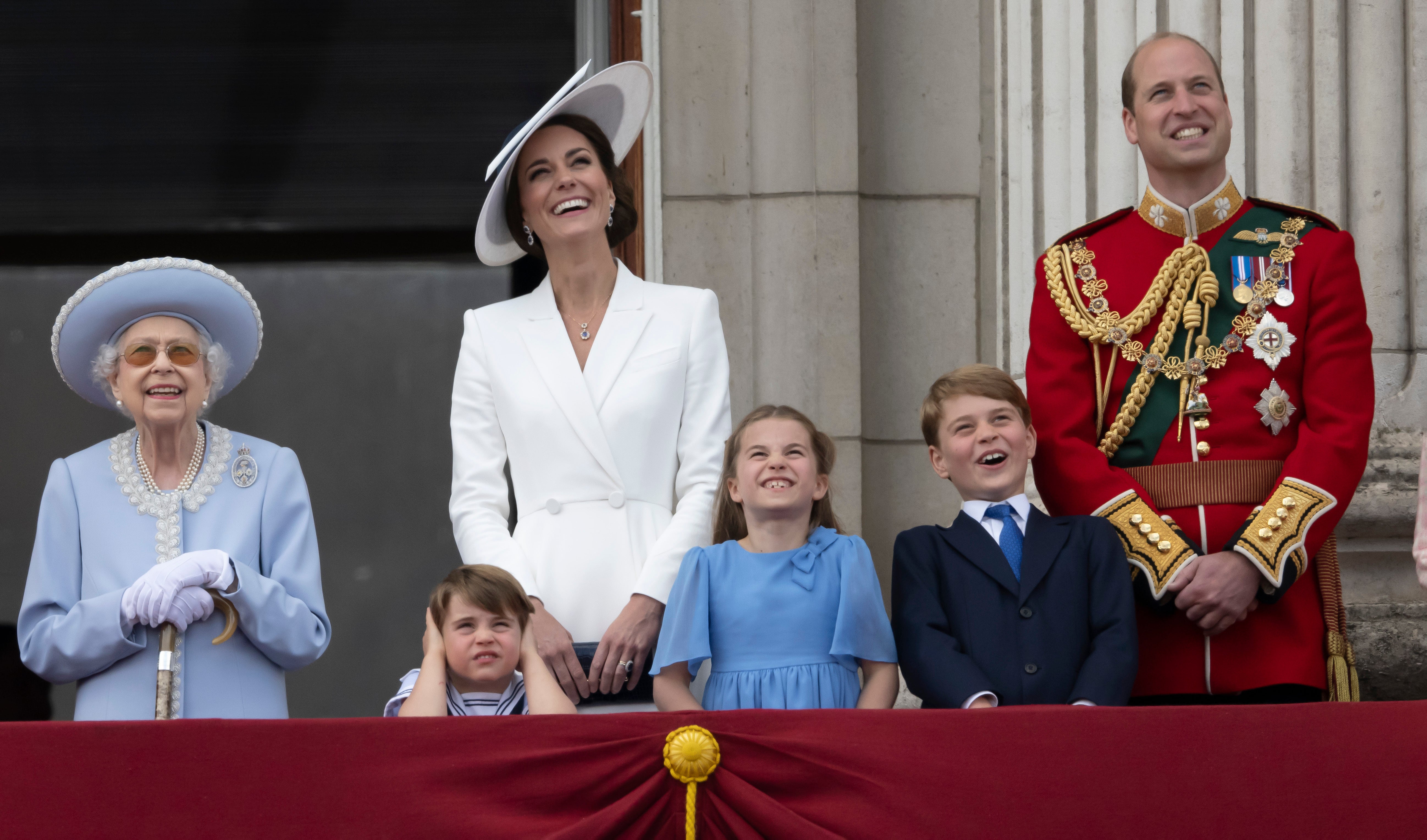 Queen Elizabeth II, Prince Louis, Kate, Duchess of Cambridge, Princess Charlotte, Prince George and Prince William gather on the balcony of Buckingham Palace, London, Thursday, June 2, 2022 as they watch a flypast of Royal Air Force aircraft pass over