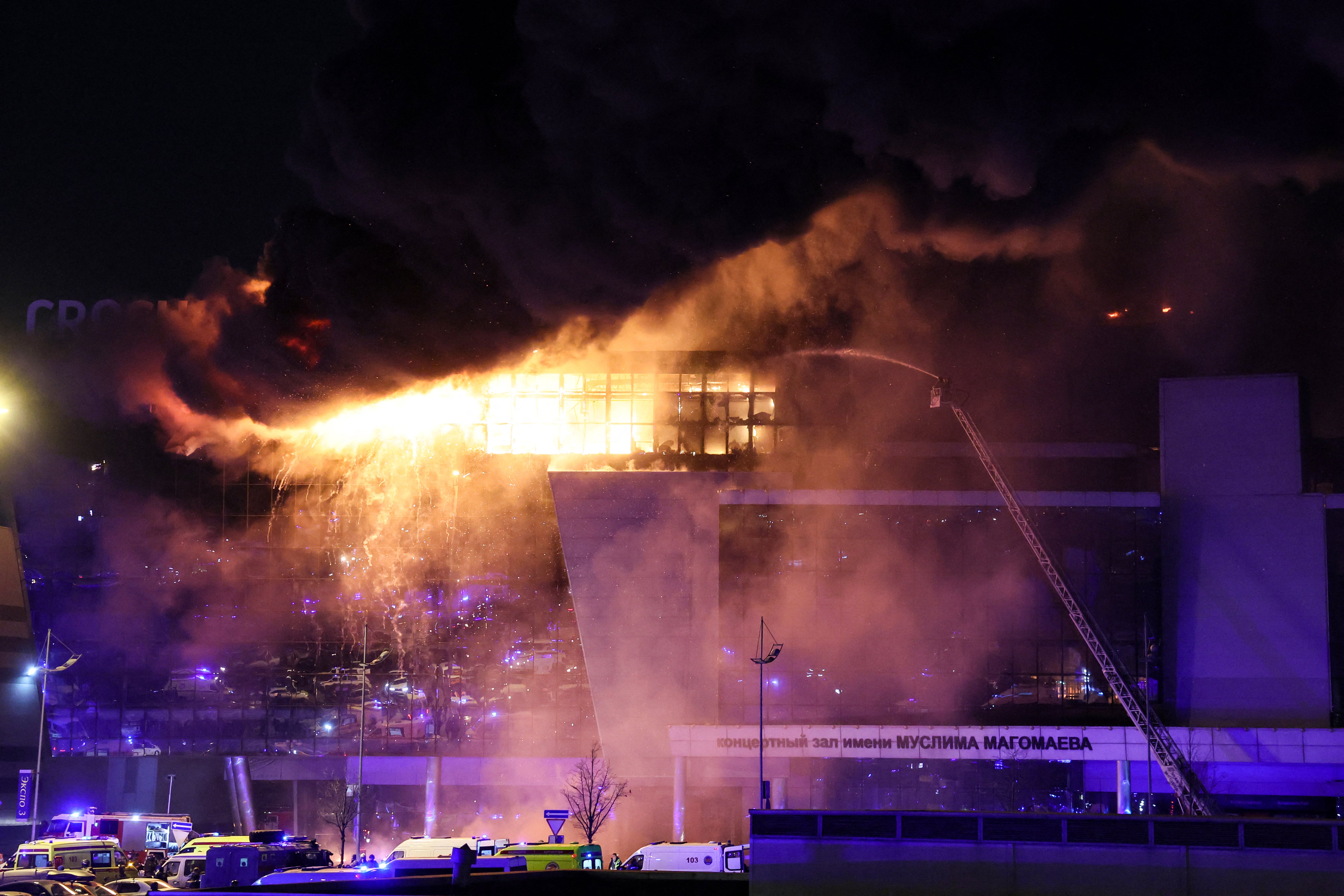A view shows the burning Crocus City Hall concert hall following the shooting incident in Krasnogorsk, outside Moscow, on 22 March 2024.