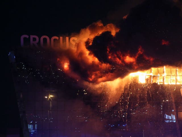 <p>Fire rises above the burning Crocus City Hall concert venue following a shooting in Krasnogorsk, outside Moscow, Russia, 22 March 2024</p>