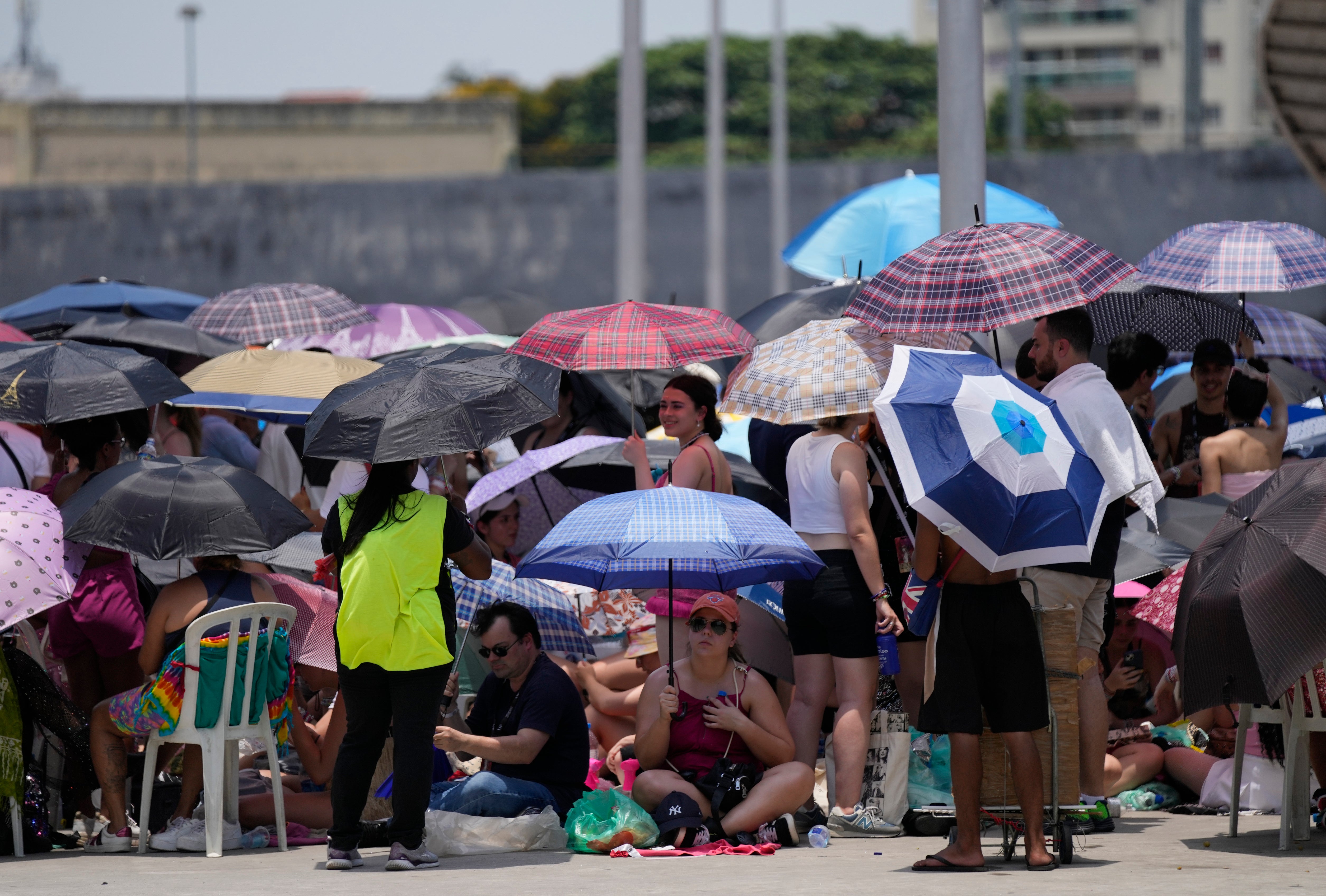 Taylor Swift fans wait for the doors of Nilton Santos Olympic stadium to open for her Eras Tour concert amid a heat wave in Rio de Janeiro, Brazil, 18 November 2023