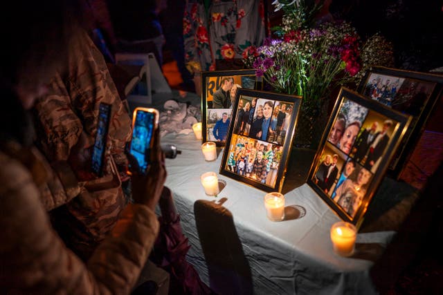 <p>A candlelight vigil for Riley Strain, held on the same street where footage last captured him alive</p>