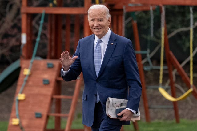 <p>President Joe Biden waves to members of the media as he walks toward Marine One on the South Lawn of the White House in Washington, Friday, March 22, 2024</p>