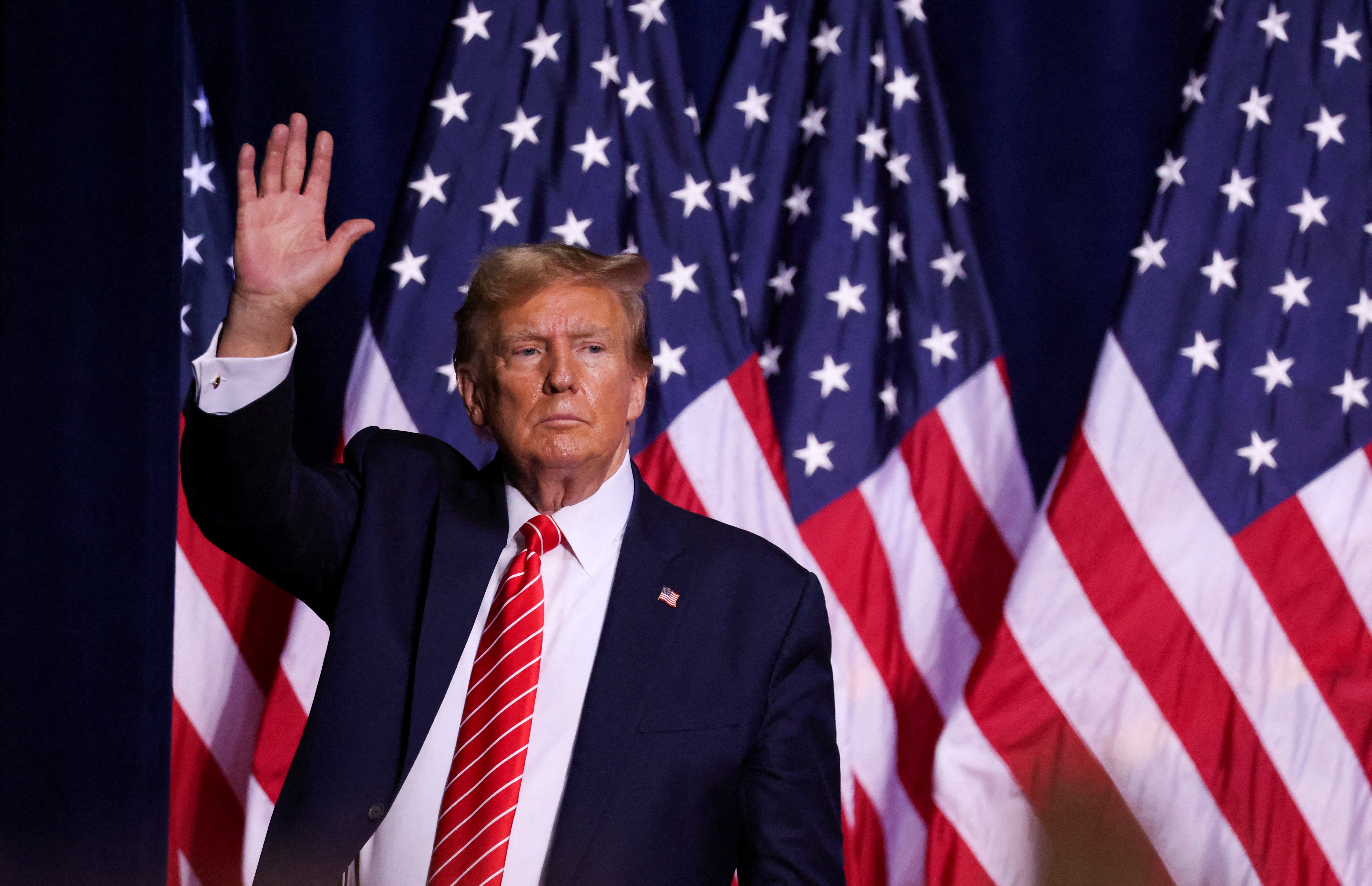Republican presidential candidate and former U.S. President Donald Trump gestures during a campaign rally at the Forum River Center in Rome, Georgia, on March 9