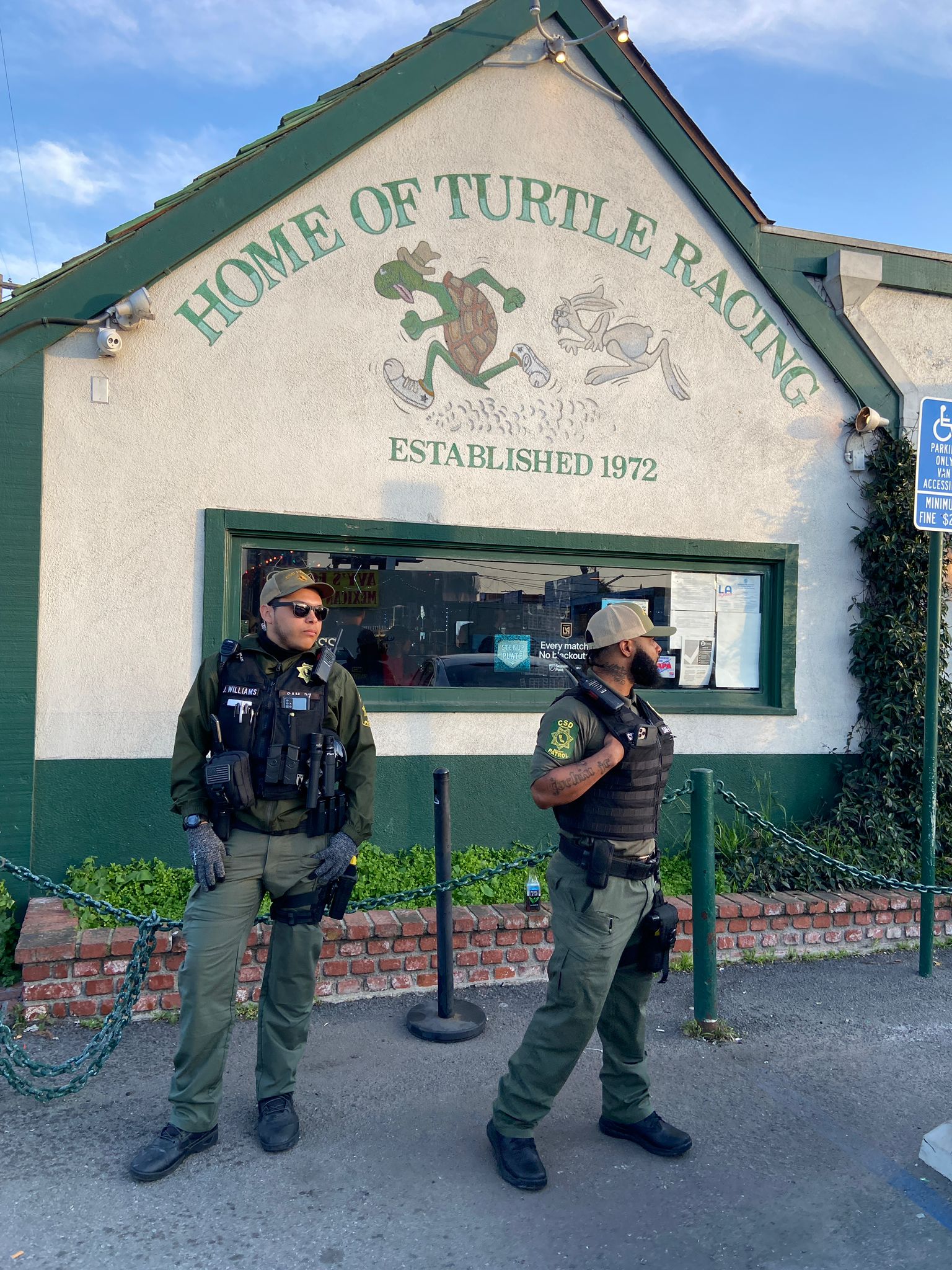 Security personnel outside Brennan’s Pub in Los Angeles