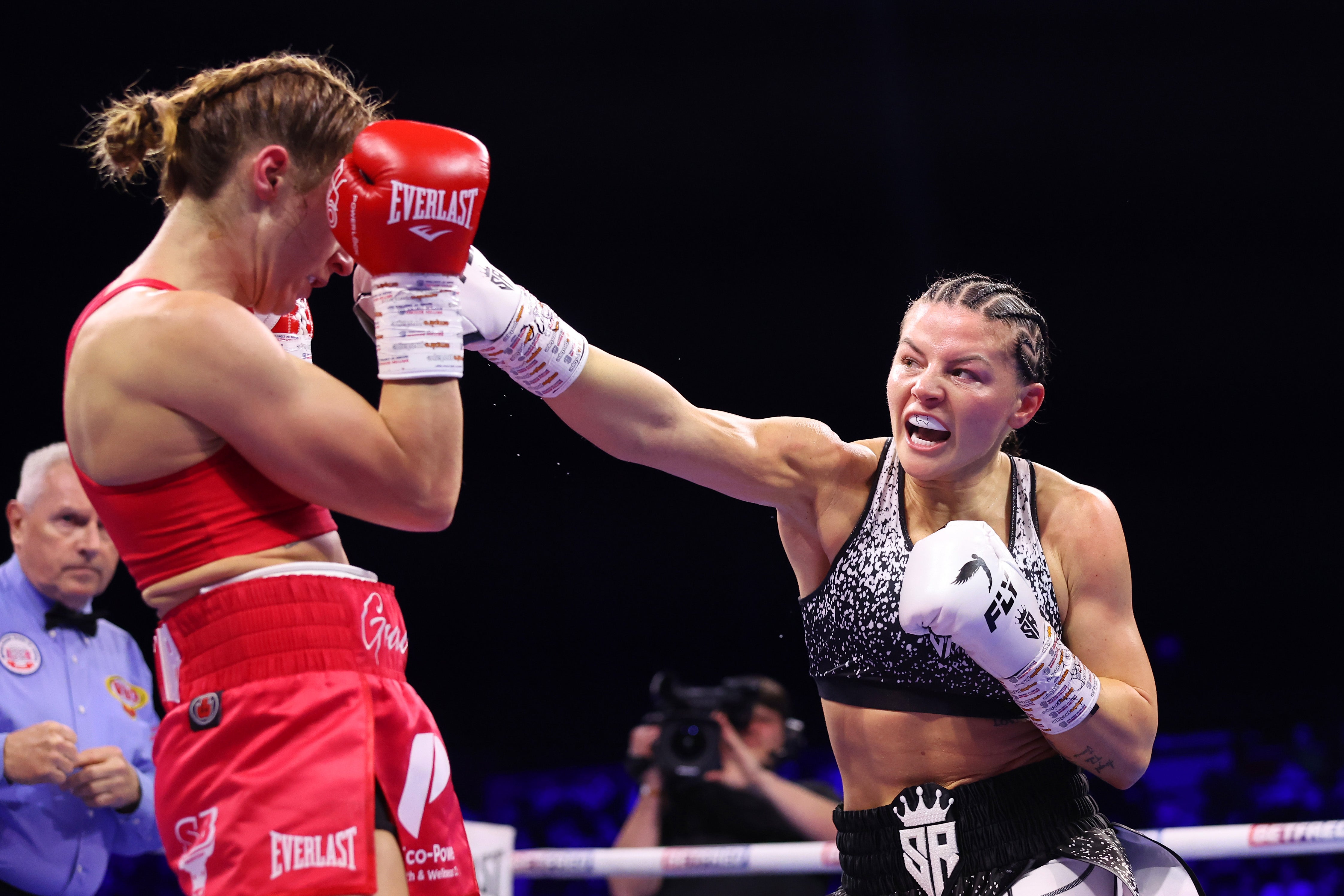 Terri Harper attempts to evade the punch from Sandy Ryan