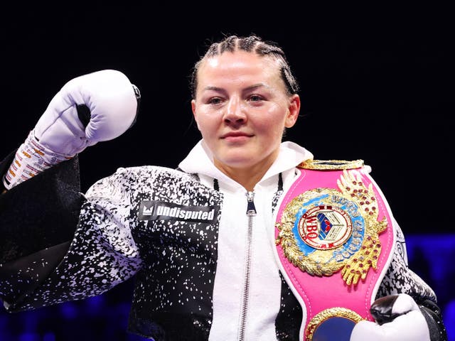 <p>Sandy Ryan celebrates victory after defeating Terri Harper</p>