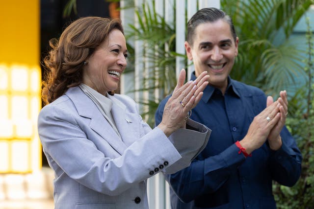 <p>Vice President Kamala Harris (left) and Frankie Miranda, Hispanic Federation president (right), applaud during a visit in San Juan, Puerto Rico</p>