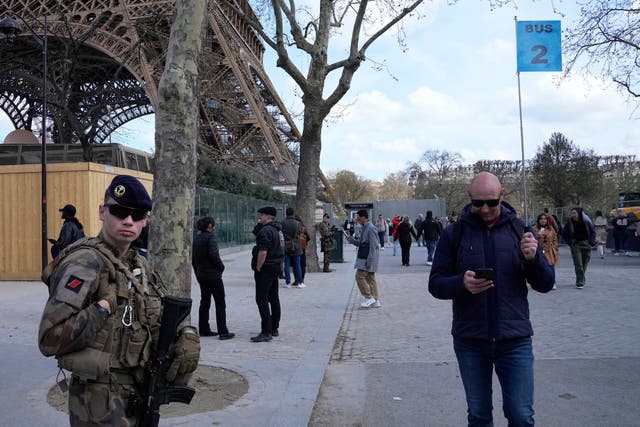 <p>A soldier patrols at the Eiffel Tower, Monday, March 25, 2024 in Paris</p>