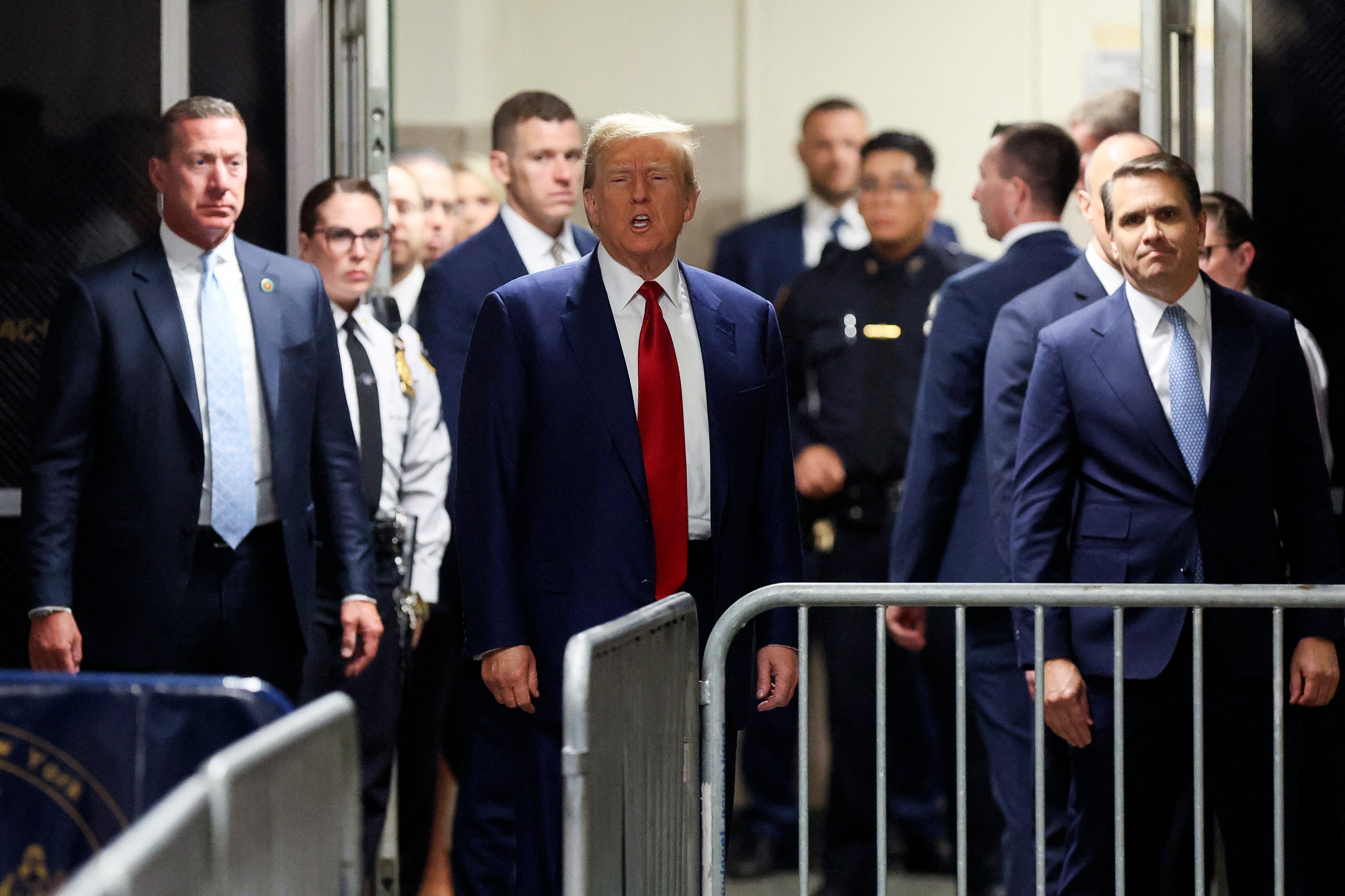 Donald Trump speaks to reporters outside a criminal courtroom doors in Manhattan on 25 March.