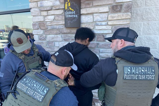 <p>US Marshals arrest Isaiah Tilghman outside a Planet Fitness in Philadelphia on Friday 22 March 2024</p>