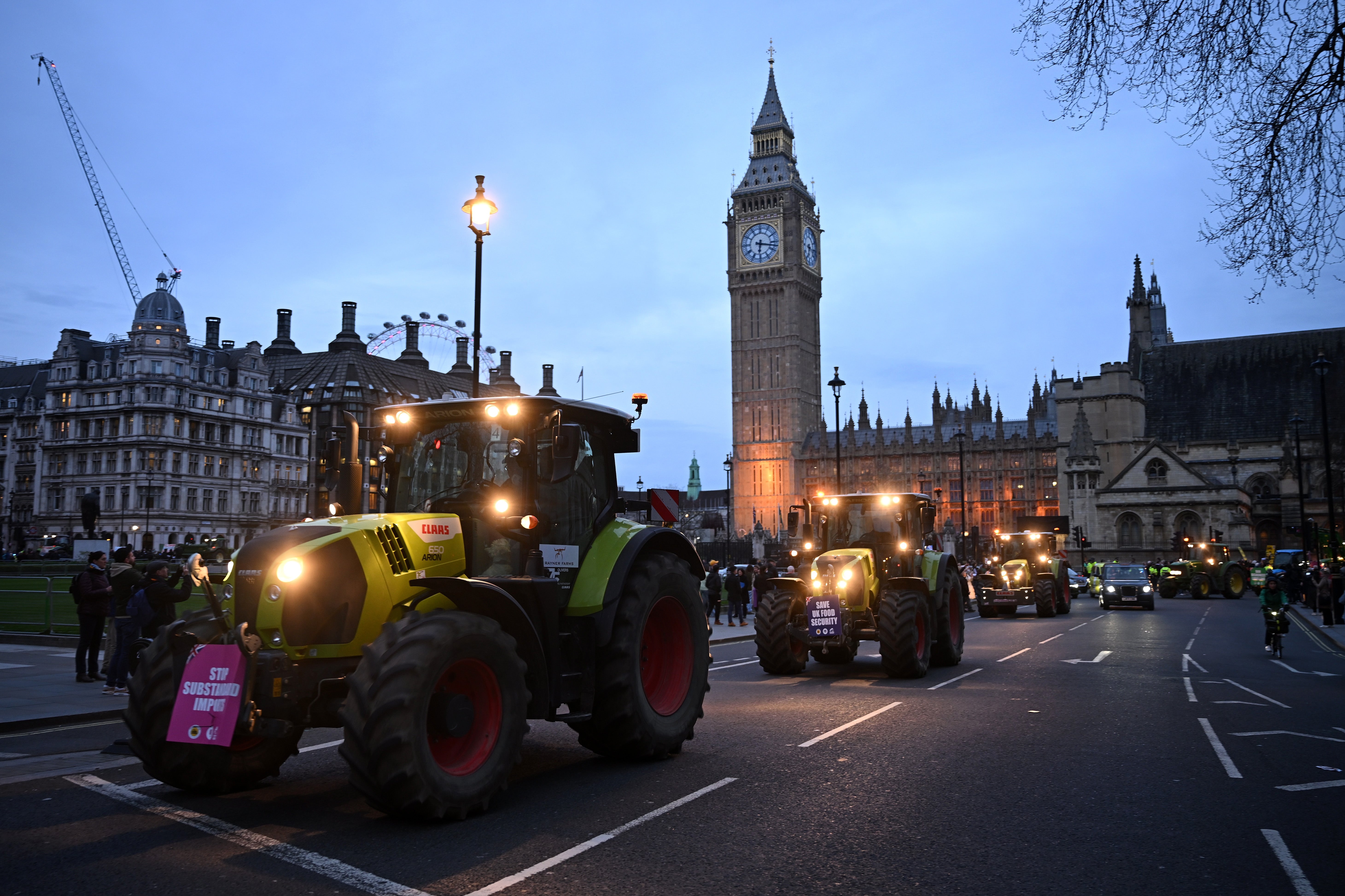 Farmers loop around Parliament Square in Westminster