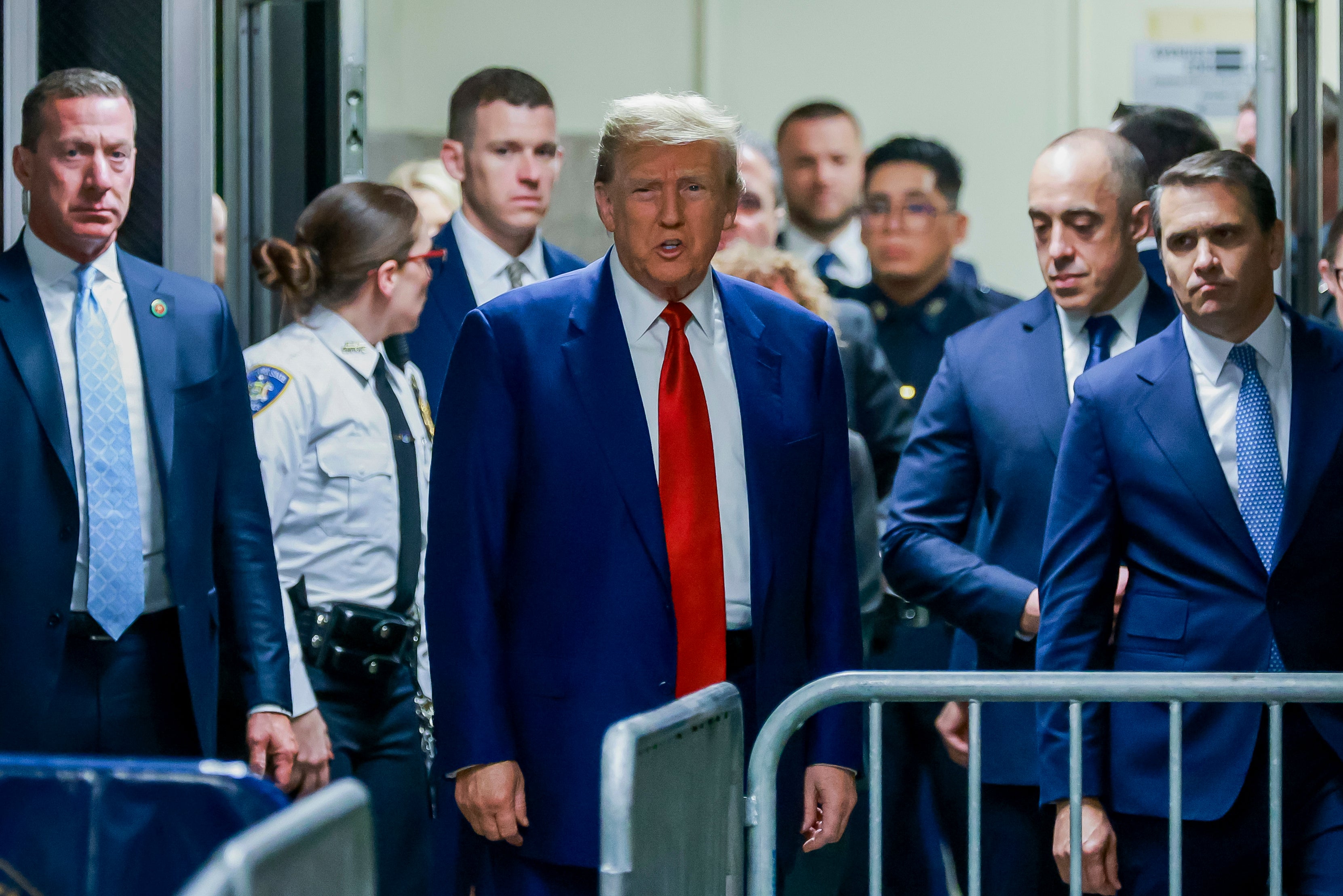 Former president Donald Trump arrives at New York Criminal Court on Monday