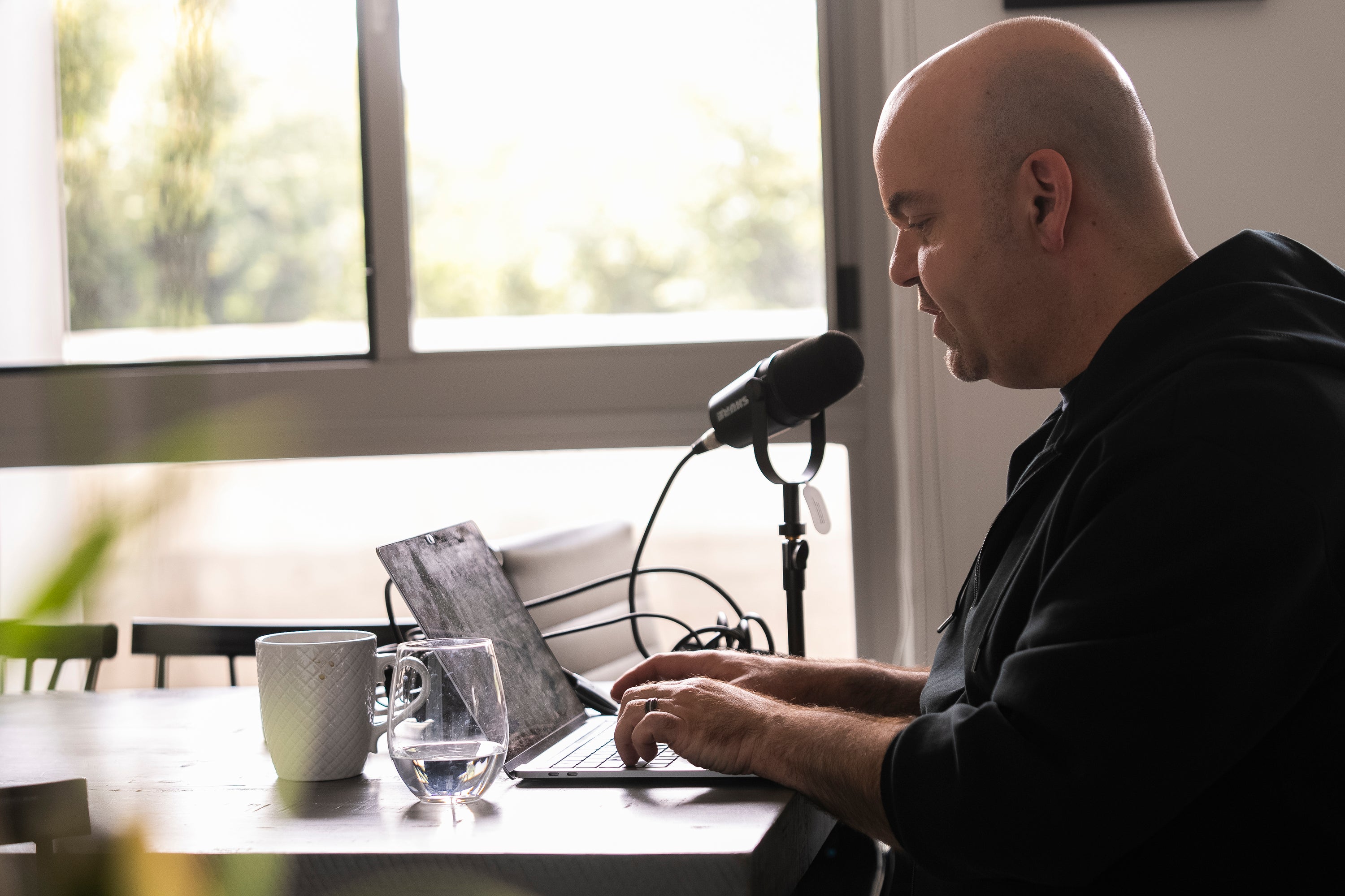 Emmy Award-winning producer Johnathan Walton works at his laptop inside his apartment in downtown Los Angeles