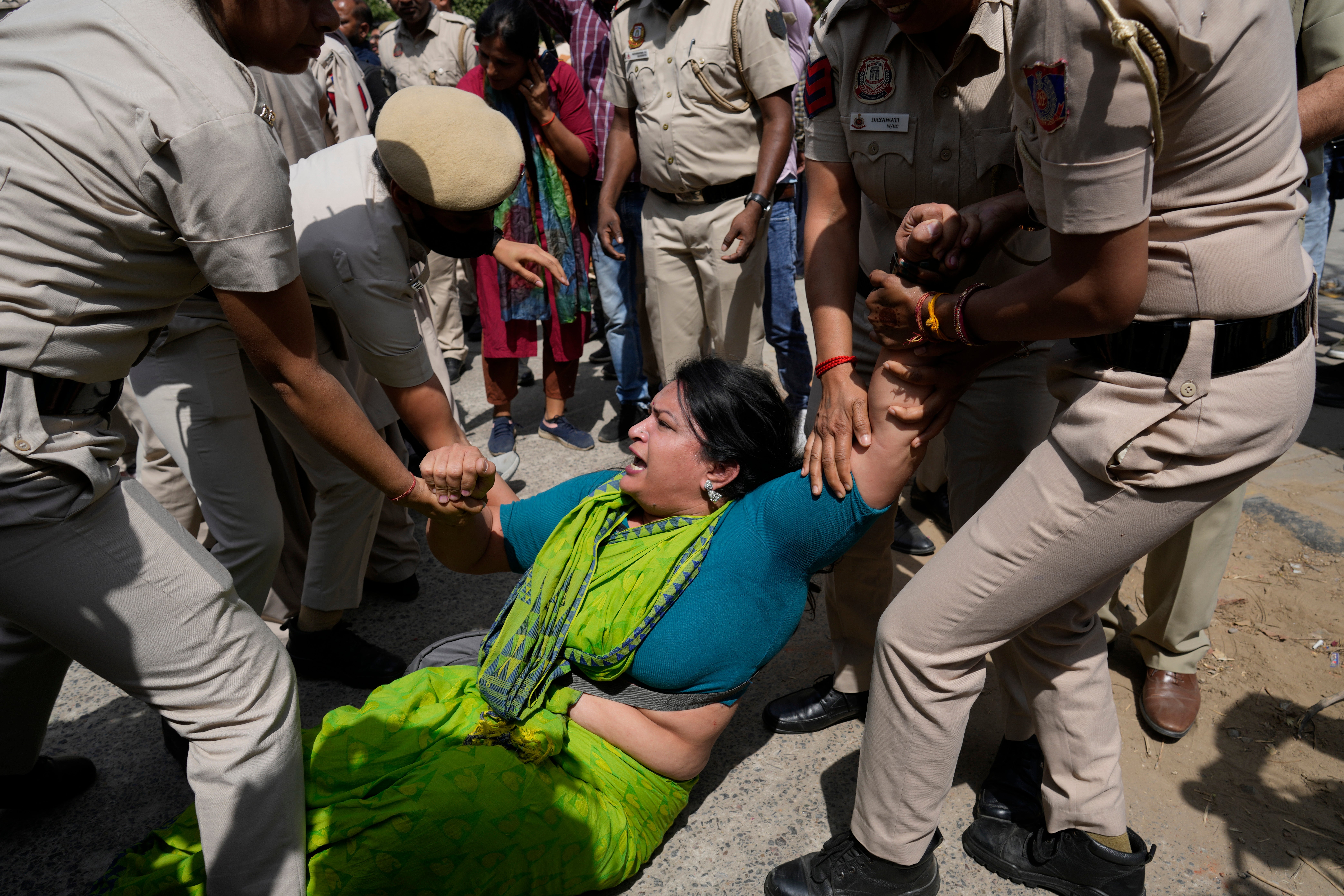 Policemen detain a member of Aam Admi Party, or Common Man's Party, during a protest against the arrest of their party leader Arvind Kejriwal in New Delhi, India, Tuesday, 26 March 2024.