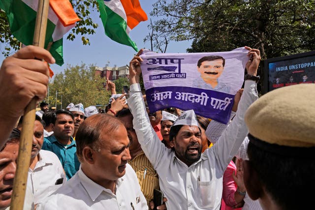 <p>Members of Aam Admi Party, or Common Man’s Party, shout slogans during a protest against the arrest of their party leader Arvind Kejriwal in New Delhi, India, Tuesday, 26 March 2024</p>
