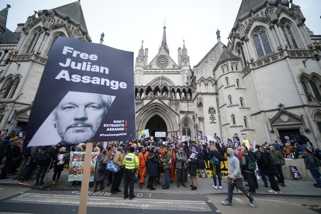<p>Supporters of Julian Assange gathered outside the Royal Courts of Justice in London (PA)</p>
