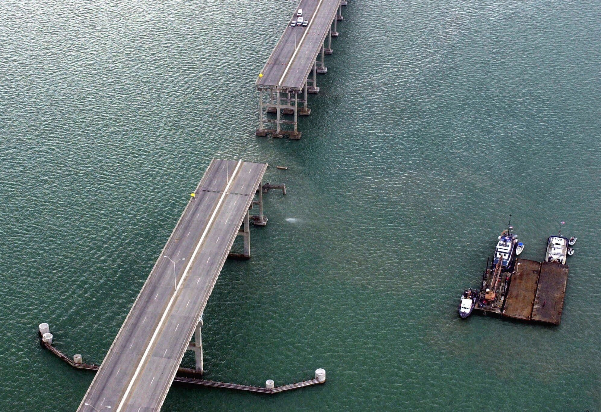 FILE - A section of the Queen Isabella Causeway is shown missing as crews break from their search and rescue