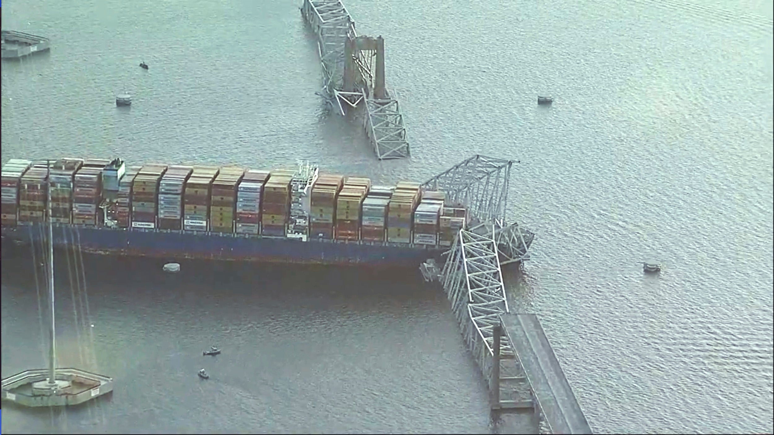 Parts of the Francis Scott Key Bridge remain after a container ship