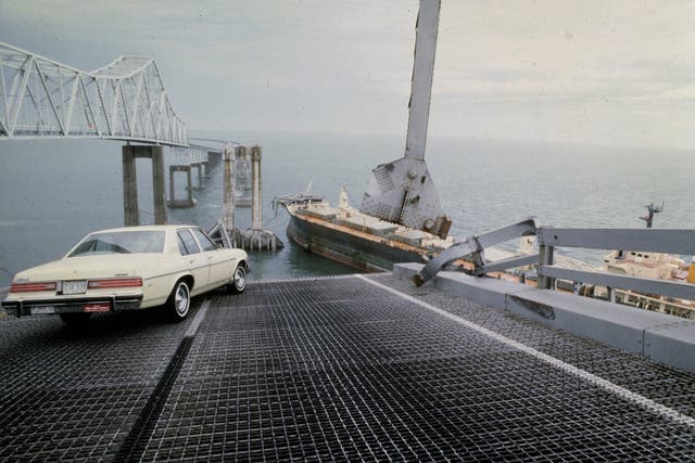 <p>A car on the edge of Sunshine Skyway Bridge </p>