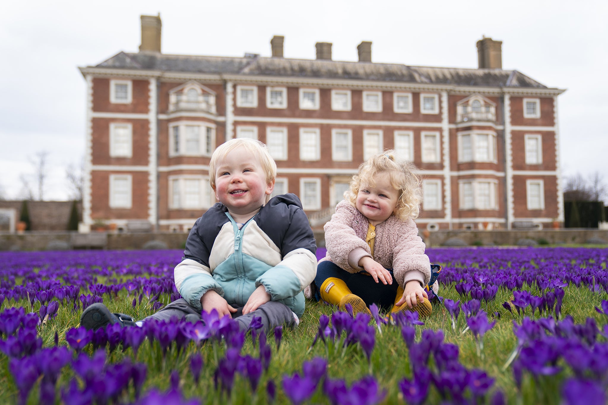 Children play on the lawn of Ham House in Richmond, London