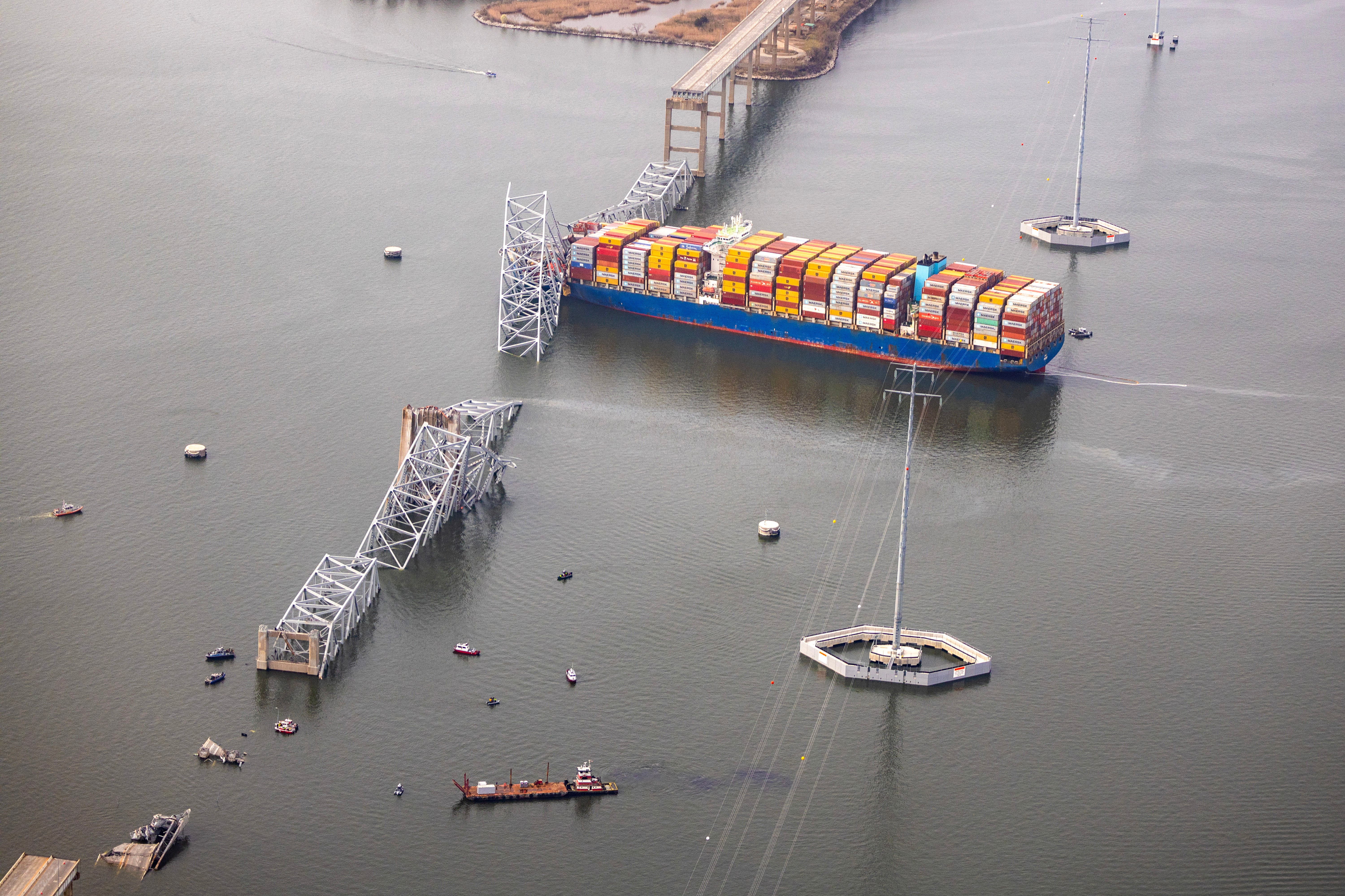 In an aerial view, cargo ship Dali is seen after running into and collapsing the Francis Scott Key Bridg