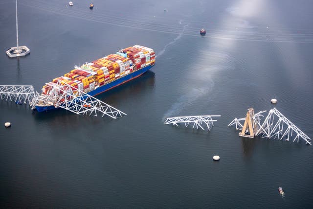 <p> In an aerial view, cargo ship Dali is seen after running into and collapsing the Francis Scott Key Bridge</p>