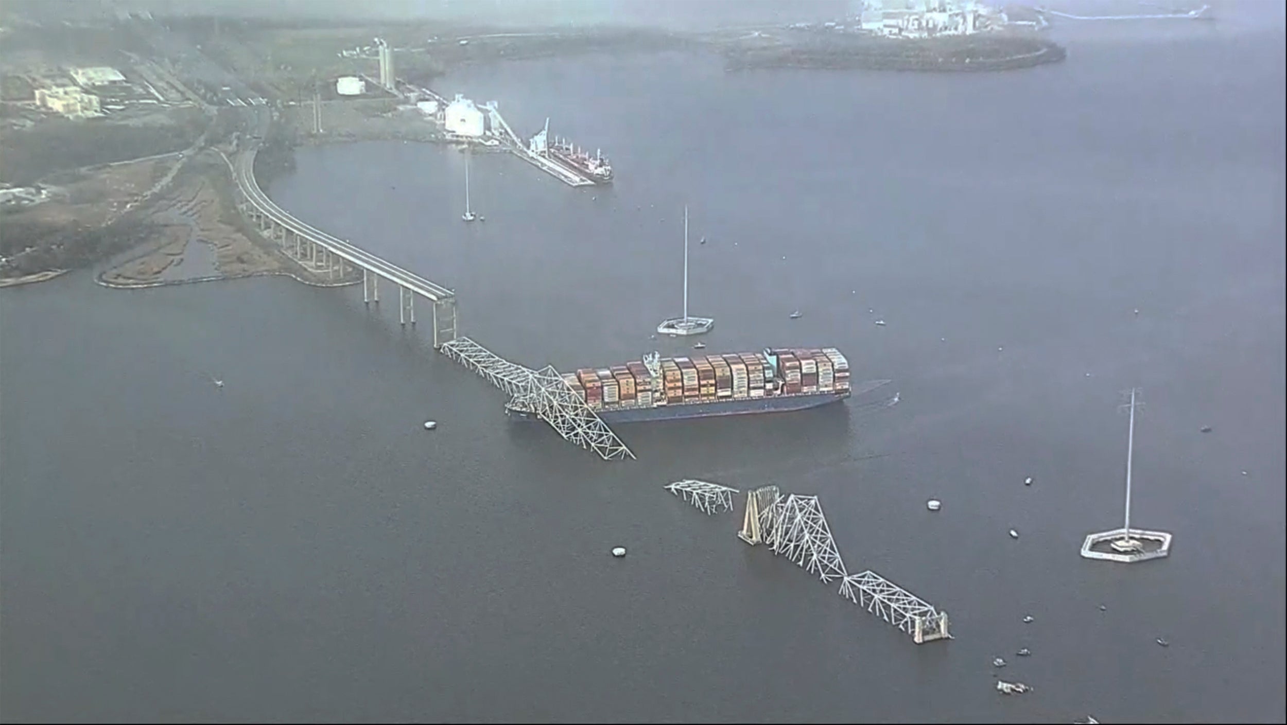 Parts of the Francis Scott Key Bridge remain after a container ship collided with one of the bridge’s support