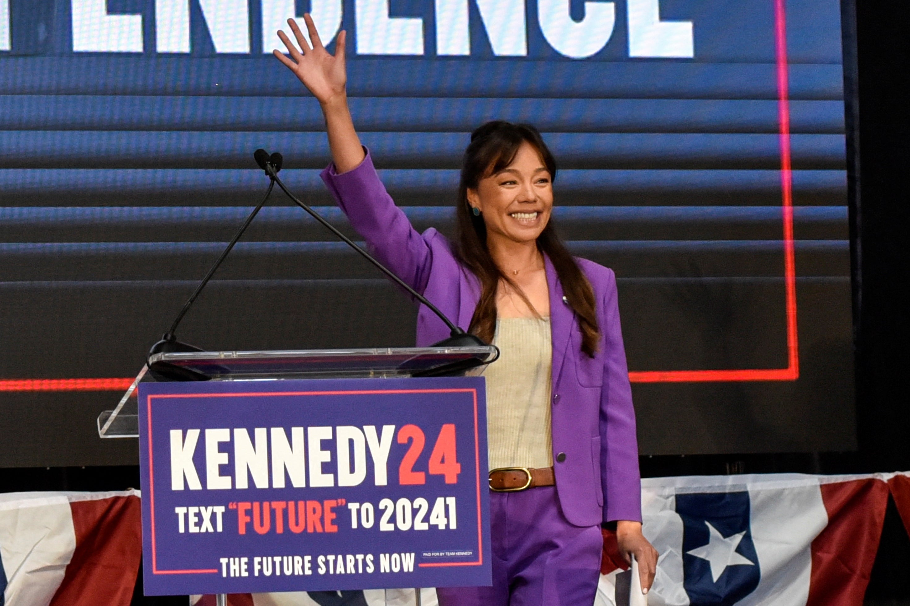 Nicole Shanahan waves as she becomes the vice presidential candidate of independent presidential candidate Robert F Kennedy, Jr, in Oakland, California