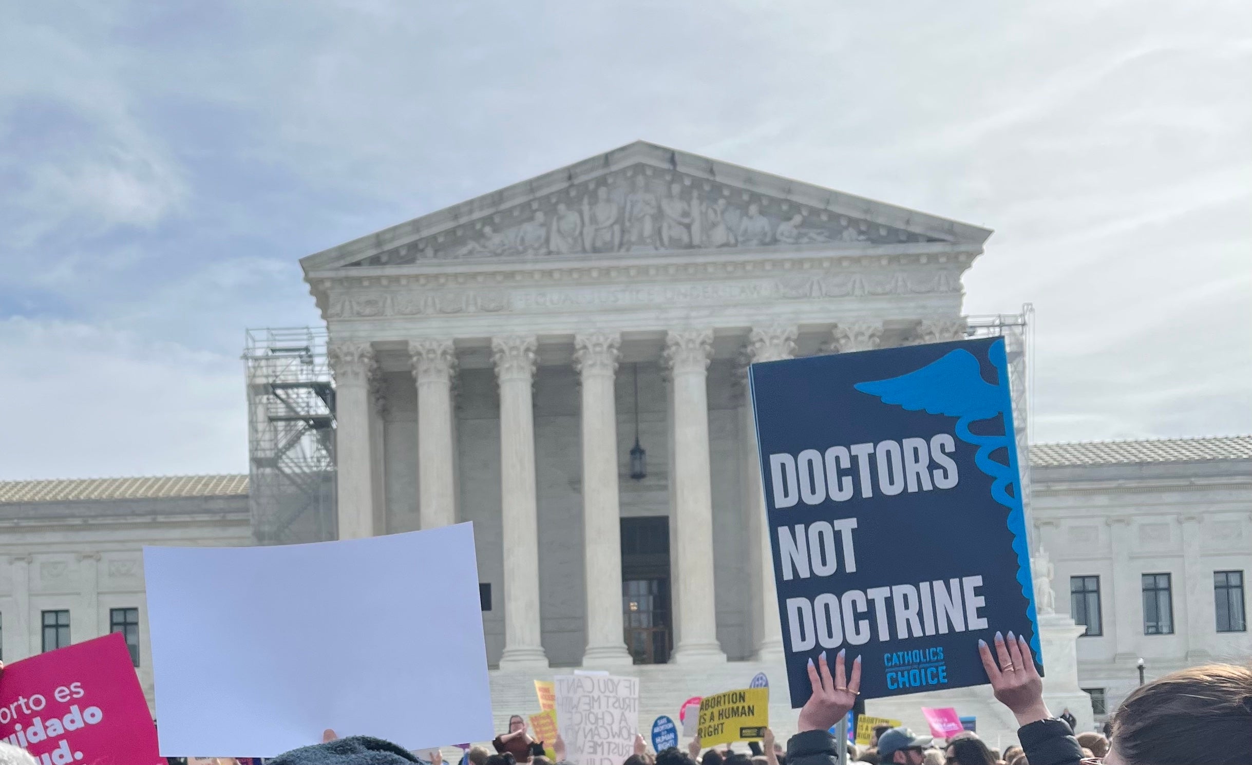 A pro-choice demonstrator holds a sign that reads, “Doctors not doctrine.”
