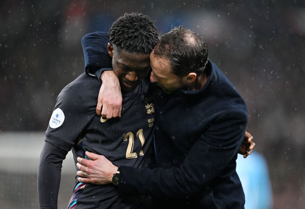 Kobbie Mainoo is greeted by Gareth Southgate after his impressive England debut