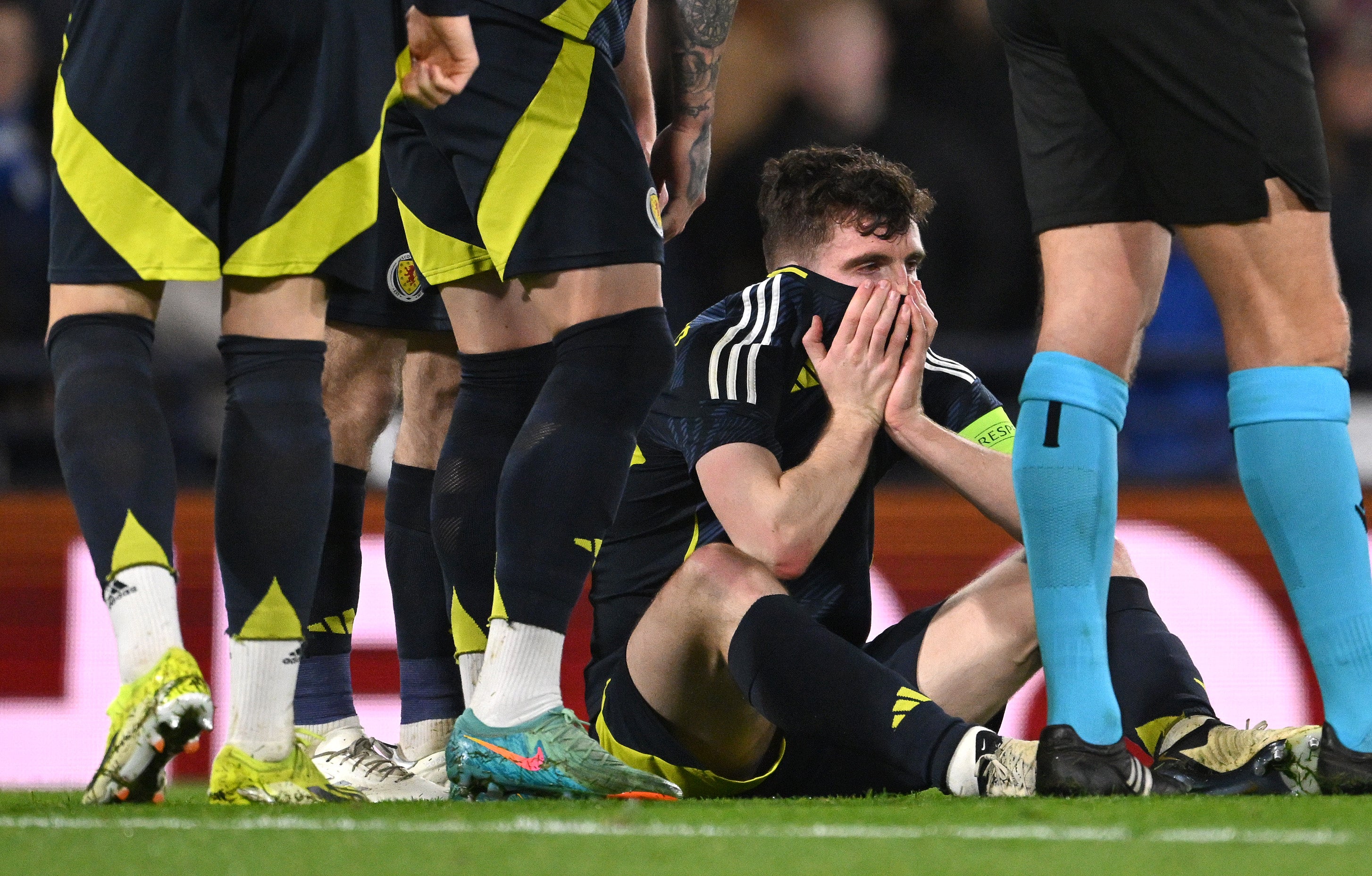 Scotland captain Andy Robertson reacts after picking up an ankle injury