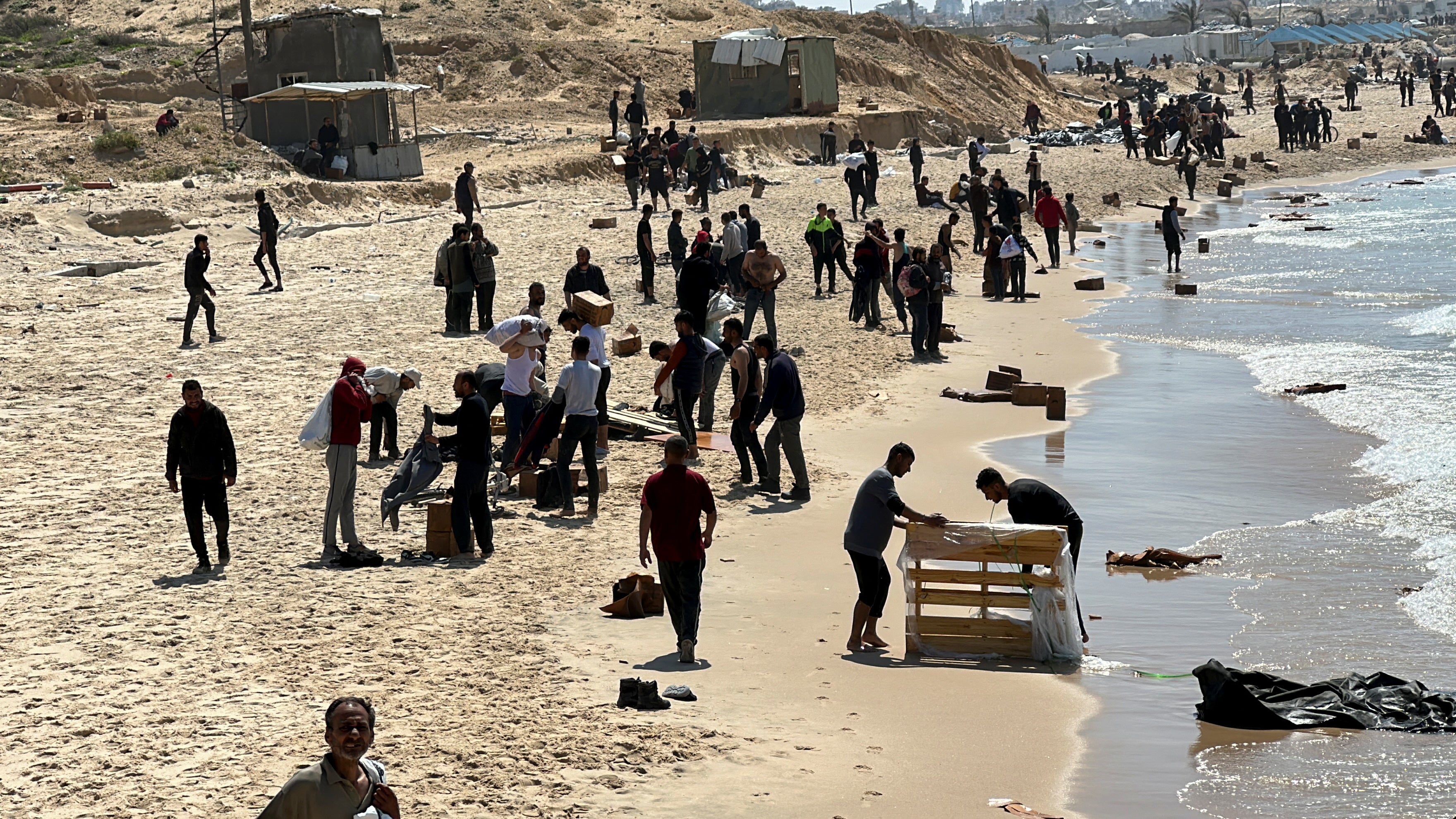 People rush to collect aid packages