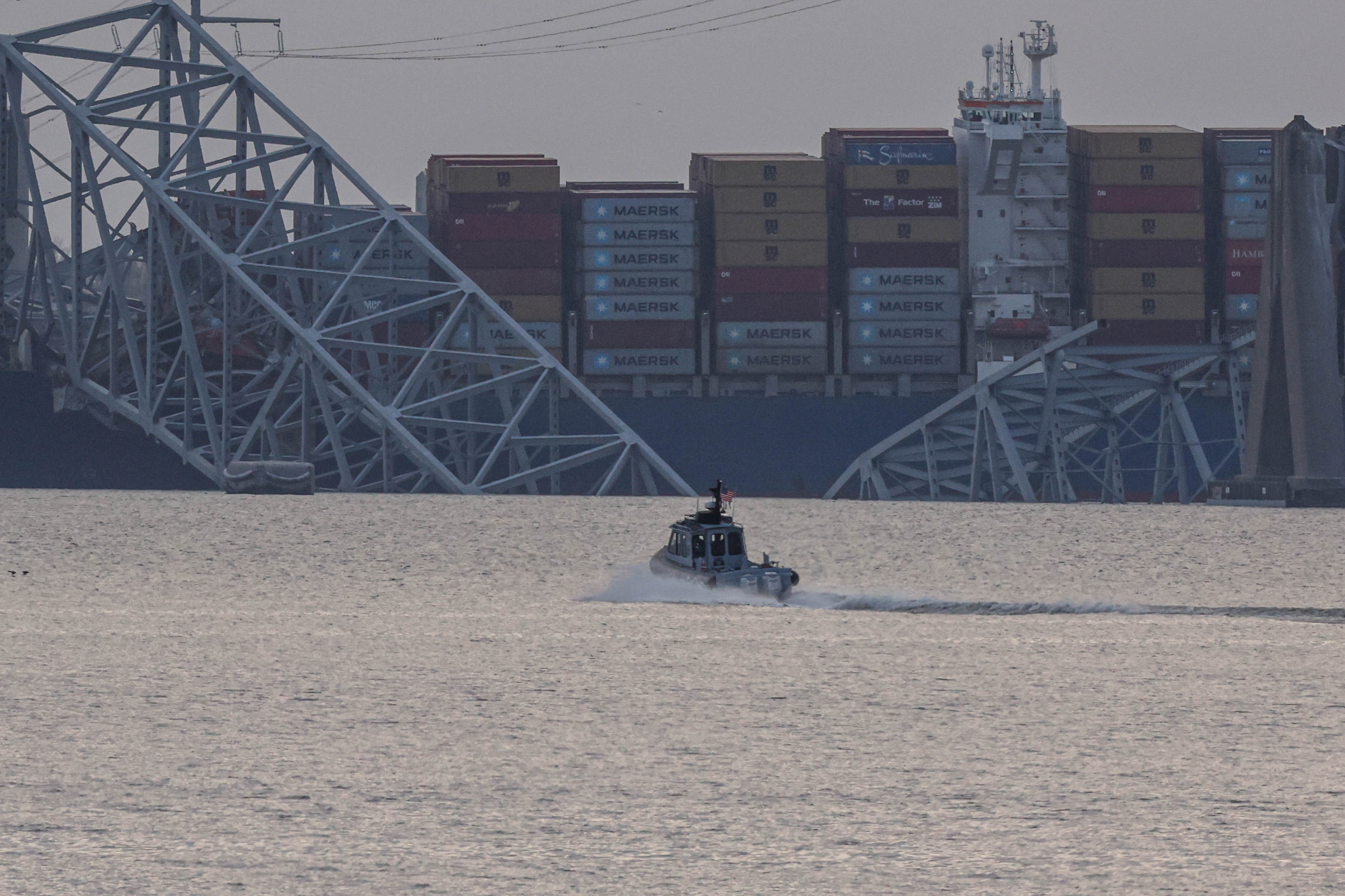 <p>The collapsed Francis Scott Key Bridge is shown after being struck by a cargo ship </p>