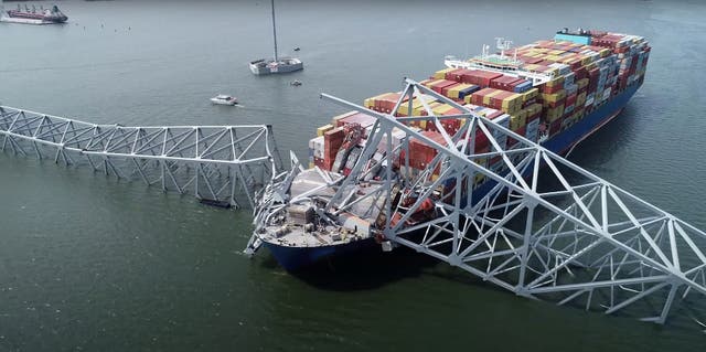 <p>Part of the steel frame of the Francis Scott Key Bridge sitting on top of the container ship Dali after the bridge collapsed in Baltimore</p>