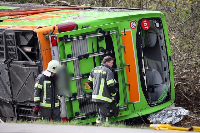 <p>A coach lies overturned on its side at the scene of an accident on the A9, near Schkeuditz, Germany</p>