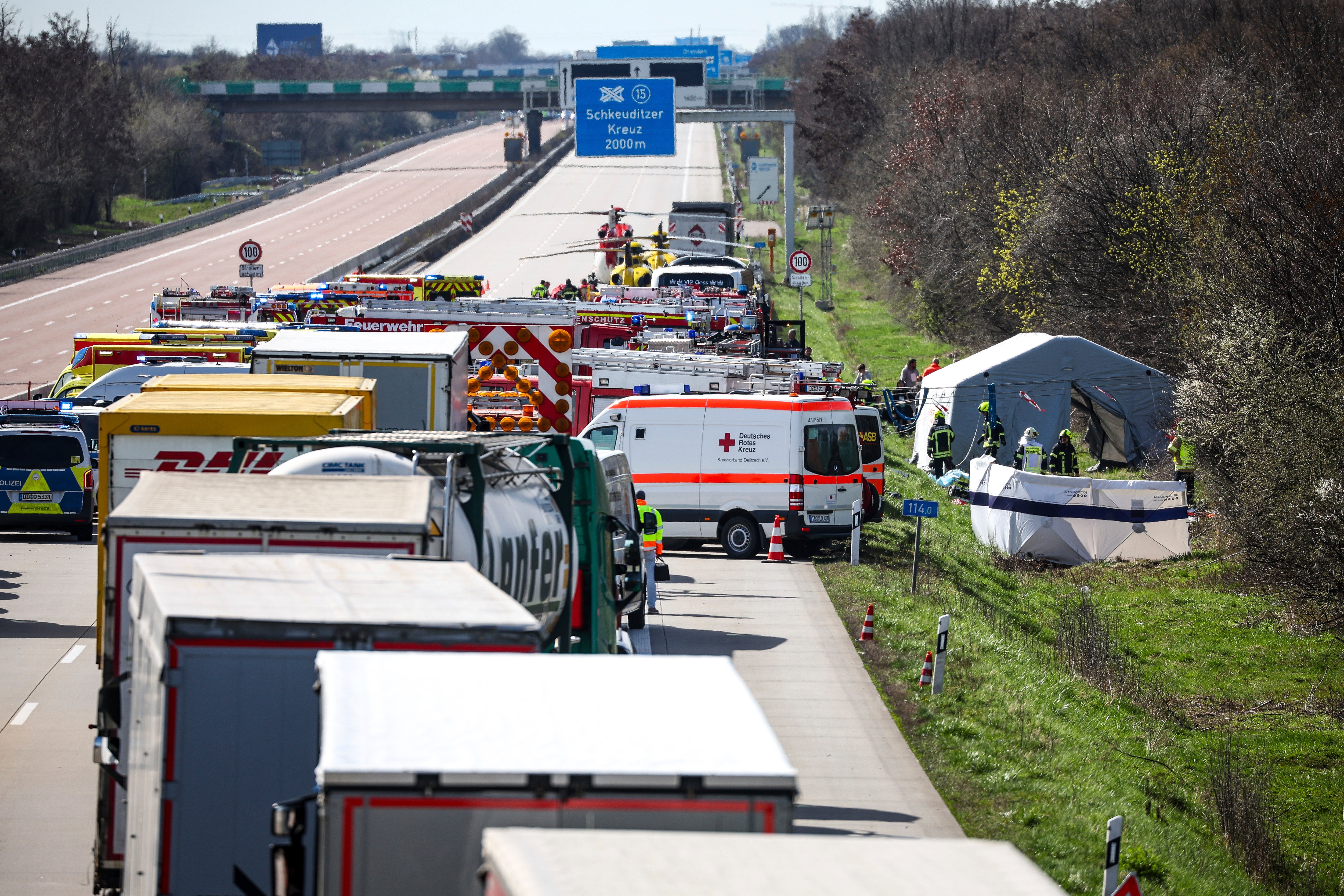 Emergency vehicles and rescue helicopters are at the scene of the accident on the A9, near Schkeuditz, Germany