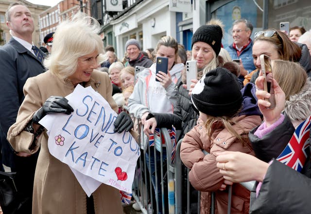 <p>As the Queen did her walkabout, two young girls handed her posters decorated with stars and hearts with a message: ‘Send love to Kate’ </p>
