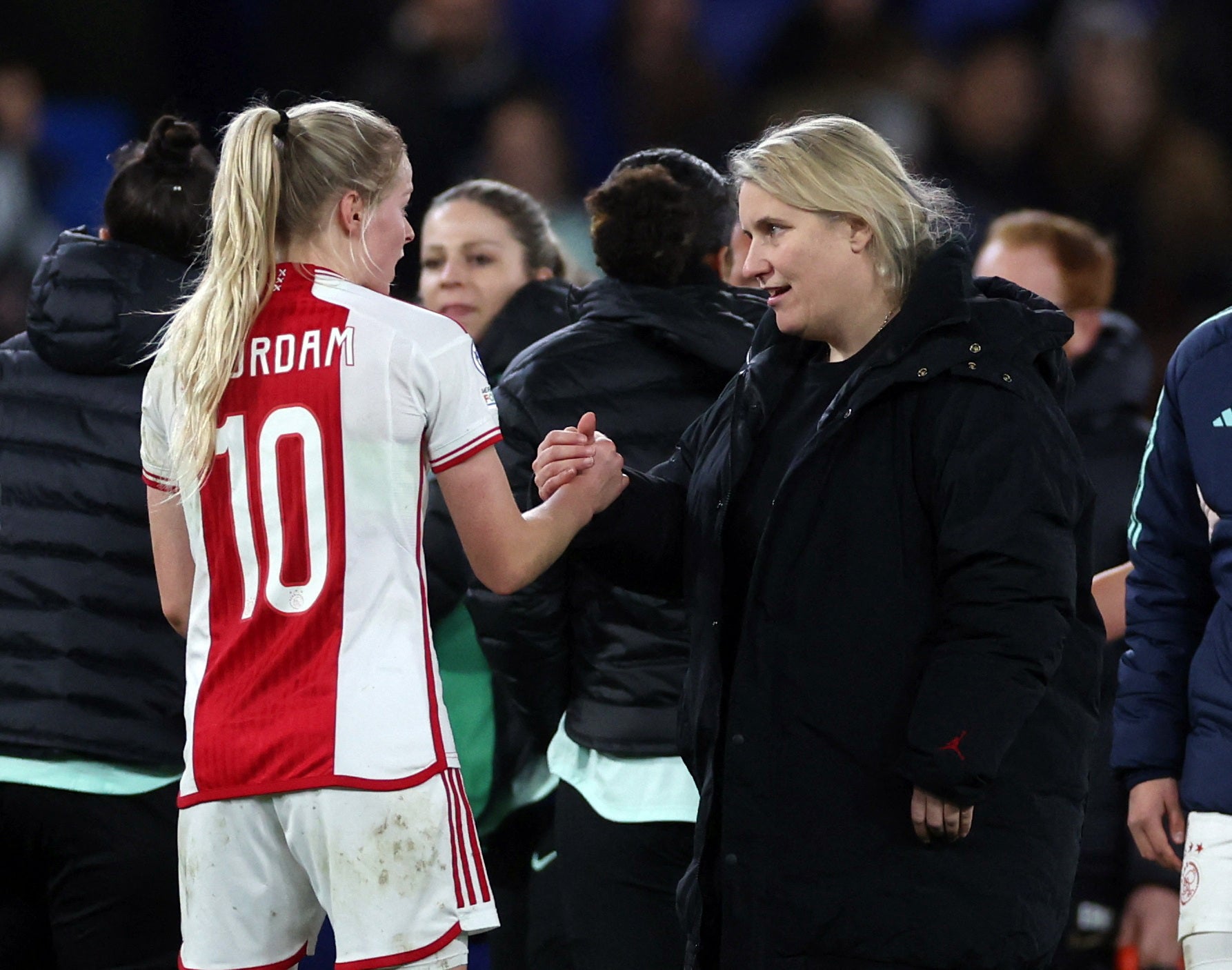 Emma Hayes, right, greets Nadine Noordam of Ajax