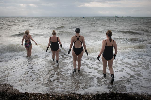 Swimmers take a dip at Thorpe Bay near Southend (PA)