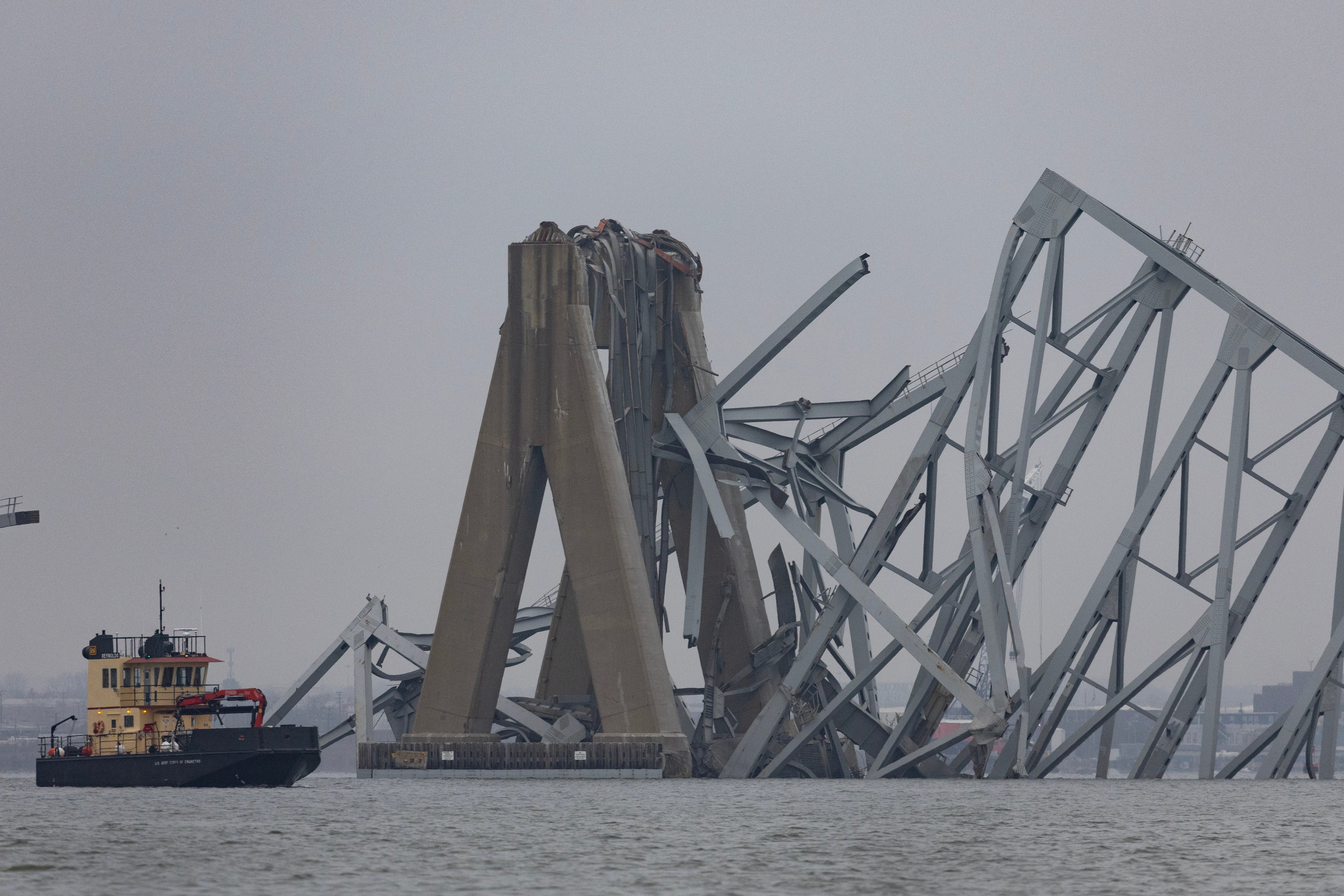 <p>Close view of the Francis Scott Key Bridge over Patapsco river shows dismantled bridge and highway that fell into the waters after a cargo ship collision</p>