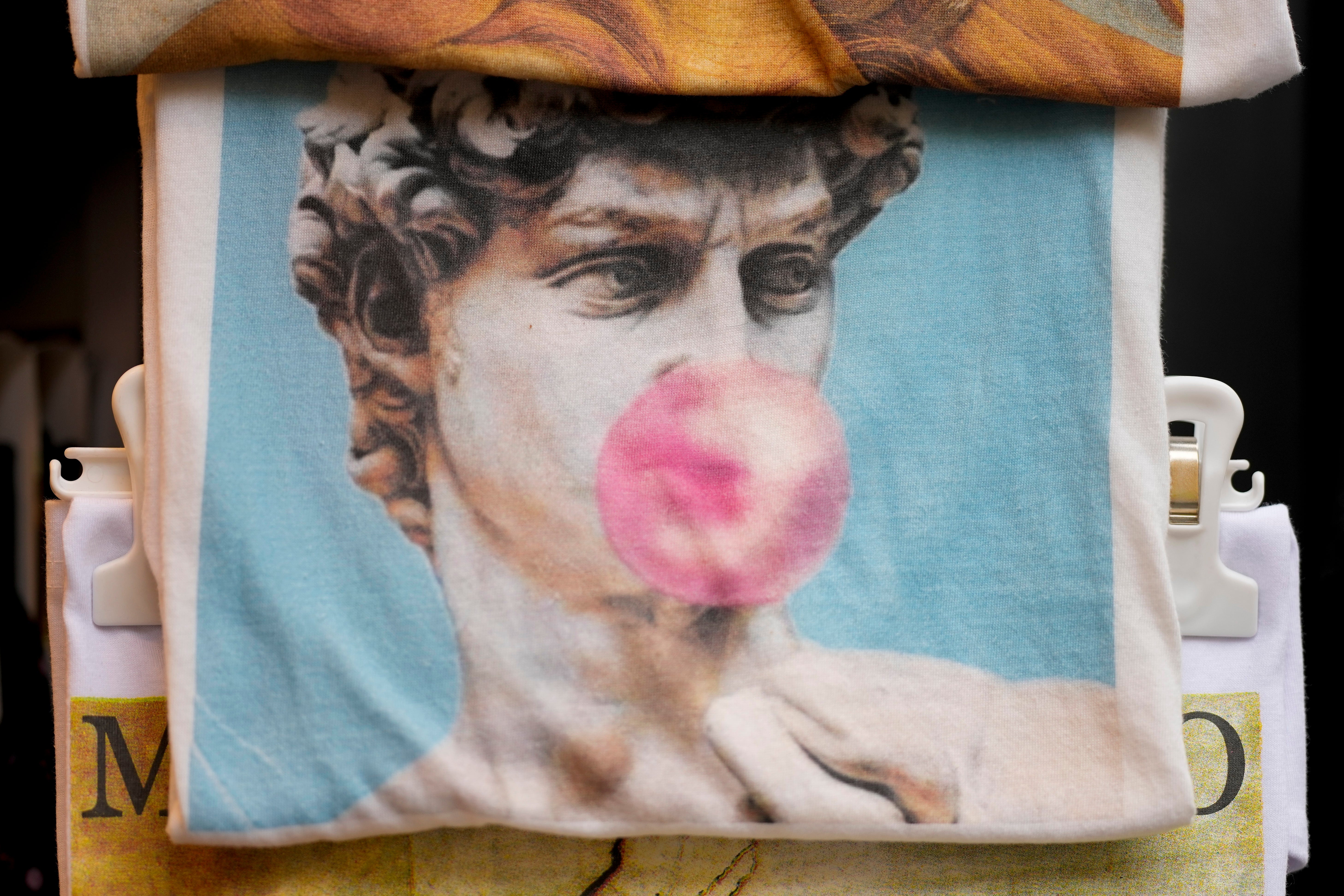 A bag depicting David blowing bubble gum on sale in Florence