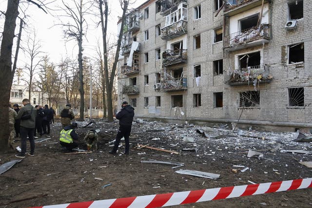 <p>Police secure the site of shelling near residential buildings in Kharkiv, Ukraine, on Wednesday </p>