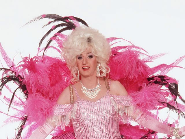 <p>Paul O’Grady described Lily Savage as ‘a hard-bitten hooker from Birkenhead with her roots showing and ripped tights and a big handbag’ </p>