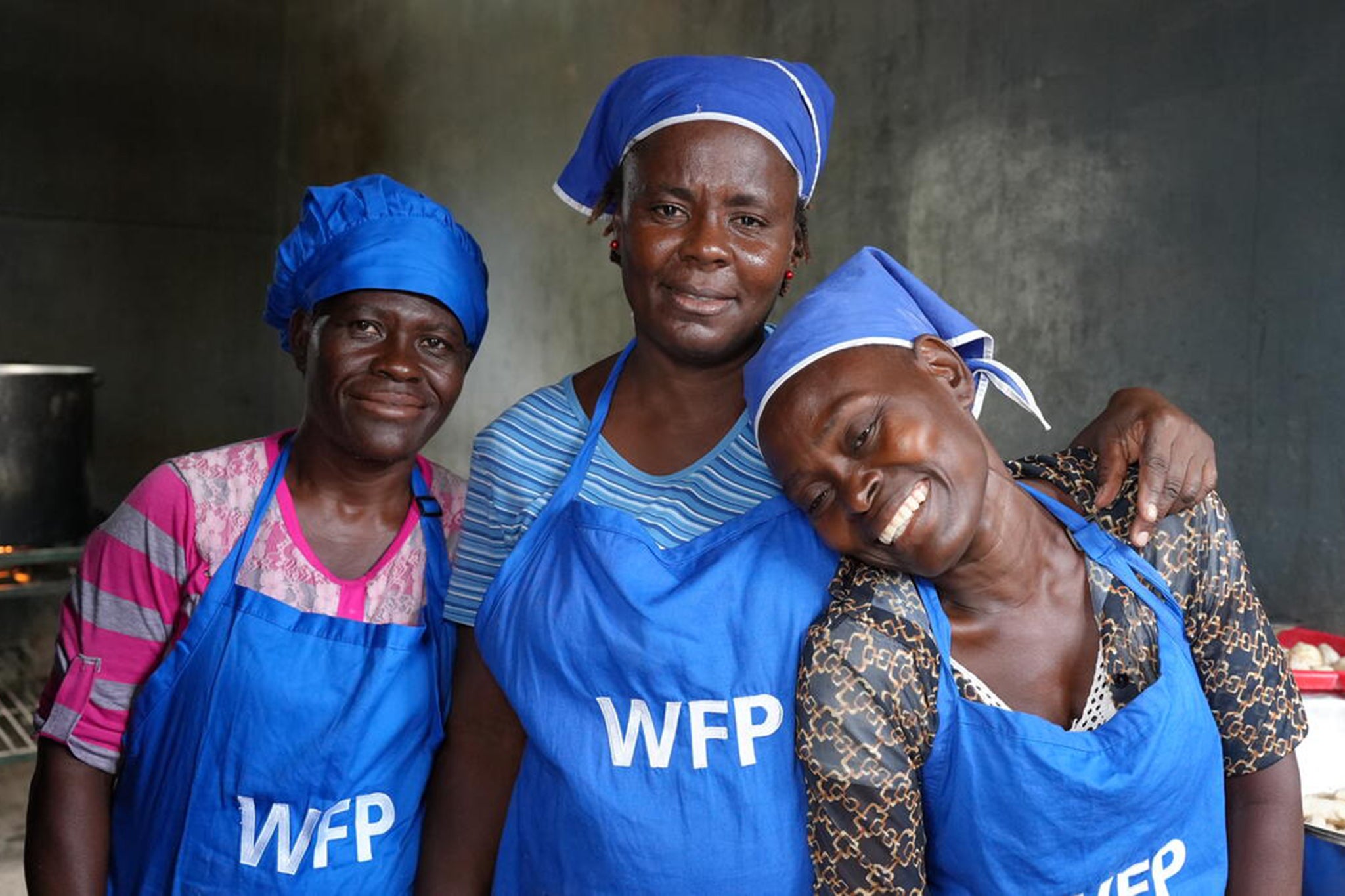 WFP workers Magali, Simone and Josie prepare school meals against a backdrop of rising hunger in Haiti