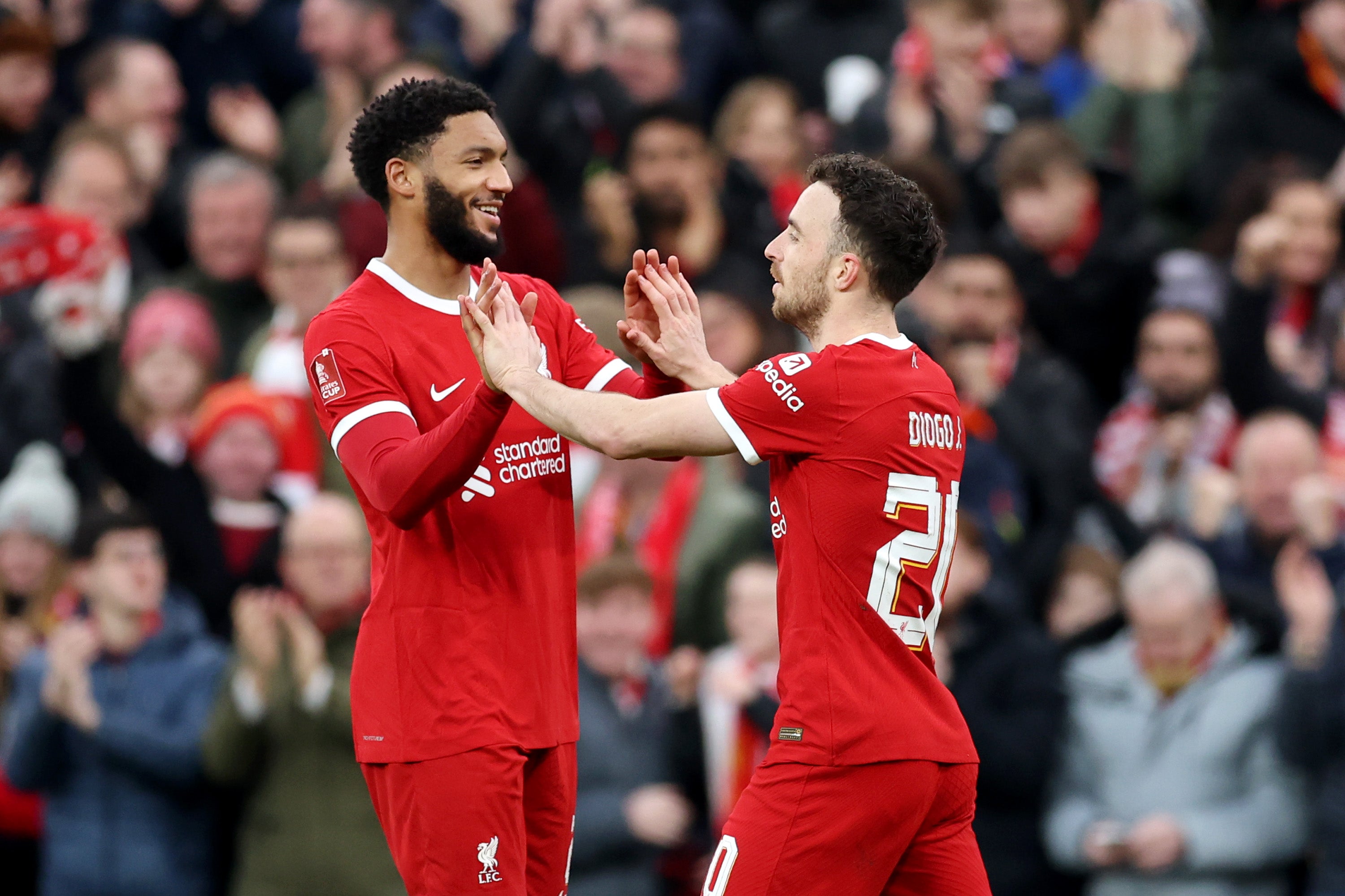Gomez celebrates with Diogo Jota in Liverpool’s 5-2 win over Norwich City in the FA Cup