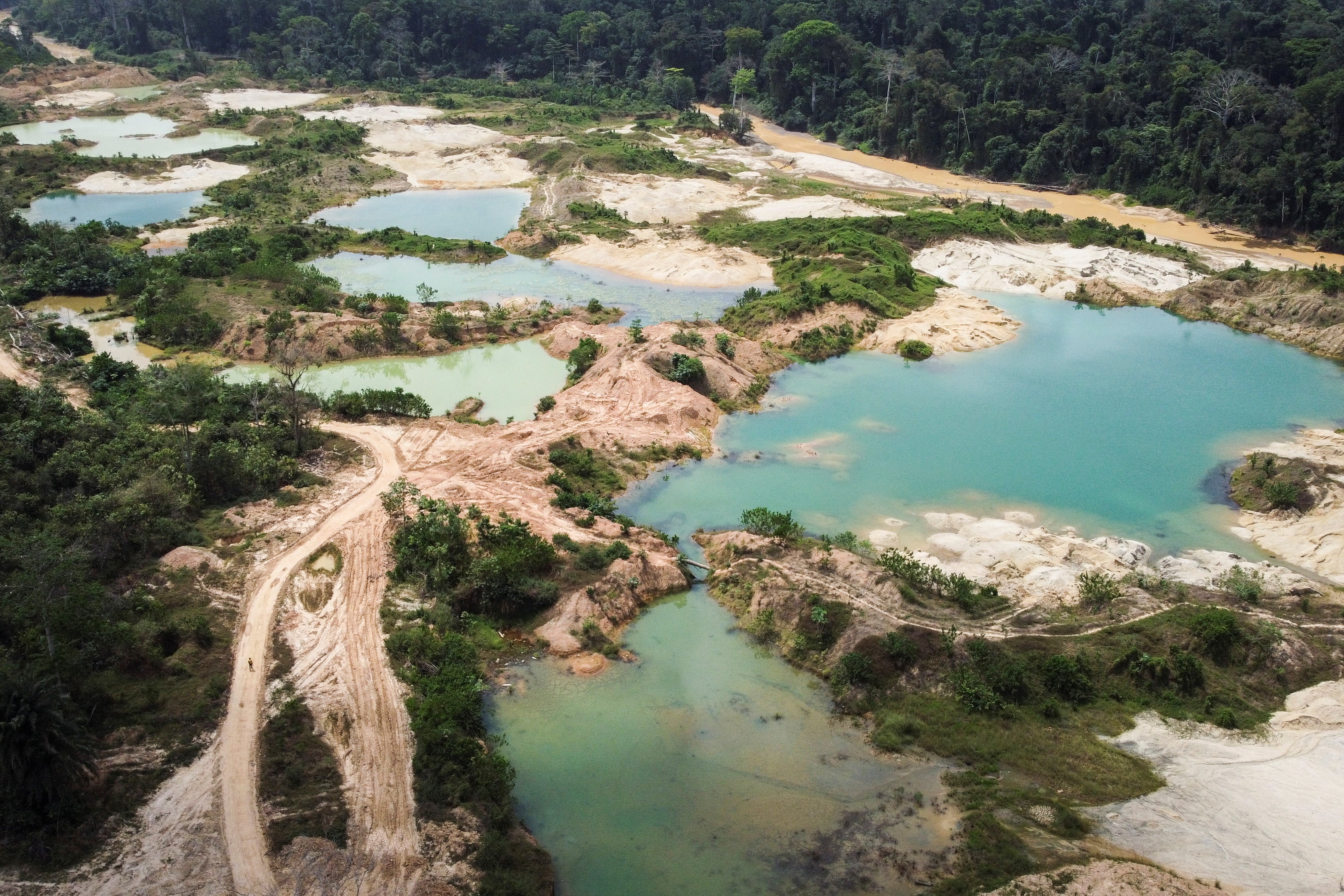 A drone view shows sections of a cocoa plantation, destroyed by illegal gold mining activities, in the Samreboi community in Ghana’s Western region