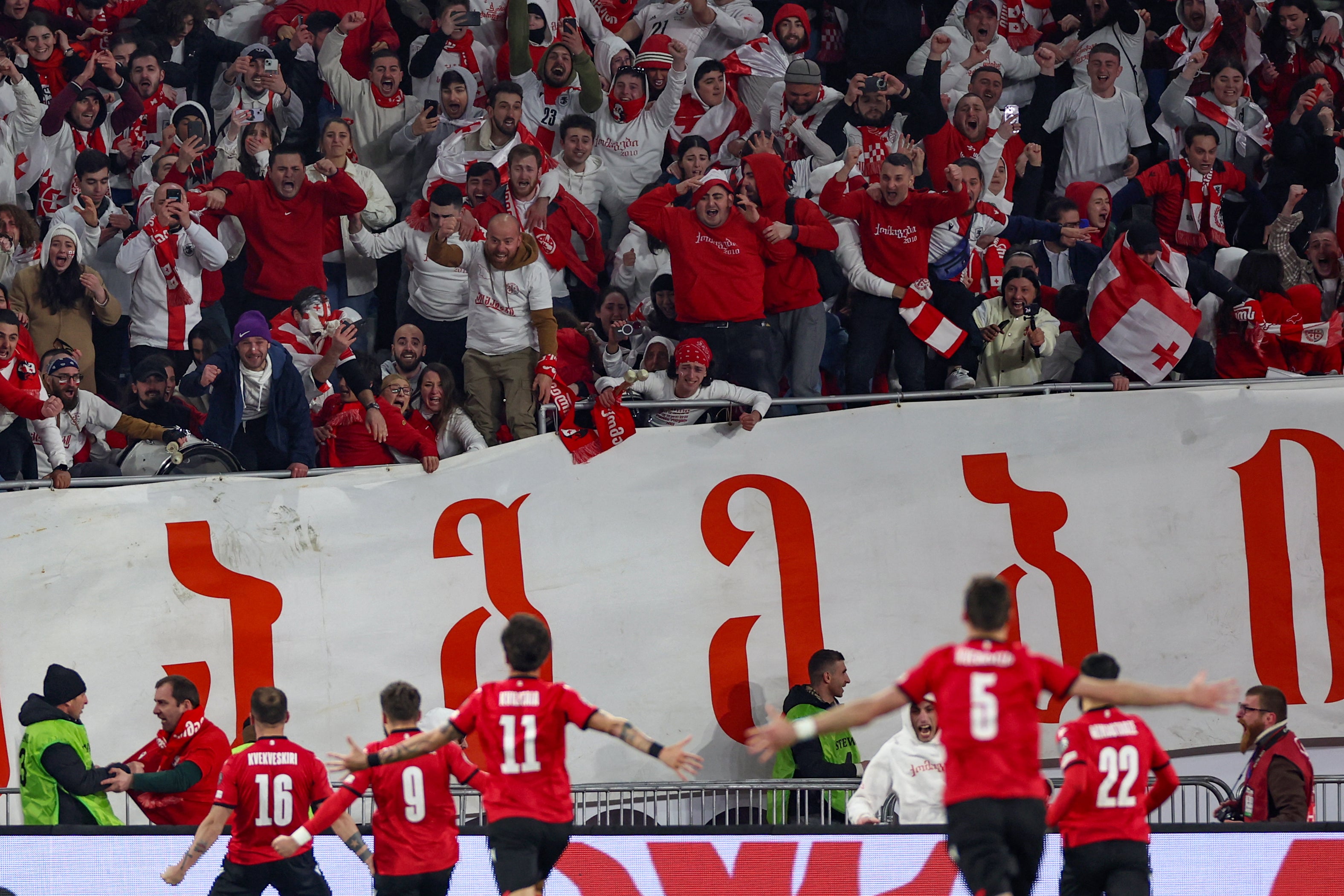 Georgia’s players celebrate after qualifying for Euro 2024