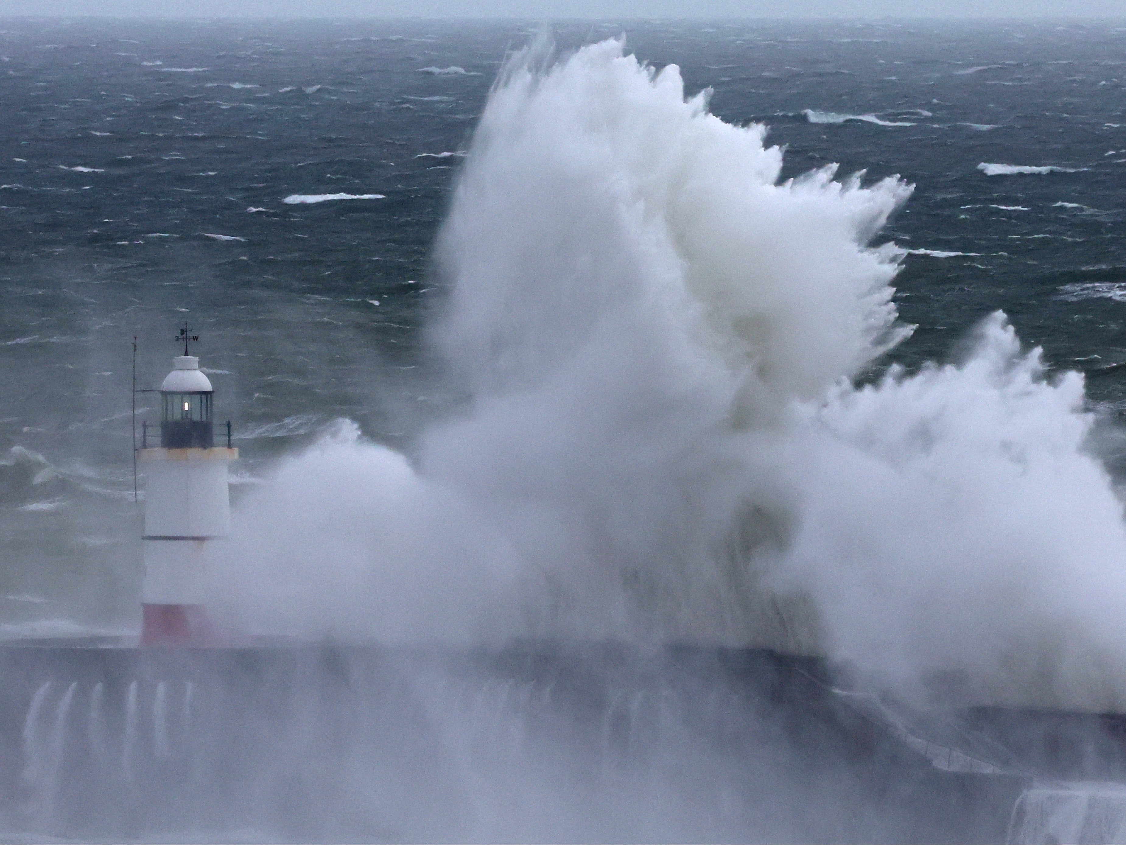 Large waves crash over the harbour wall as Storm Nelson hits Newhaven, Sussex